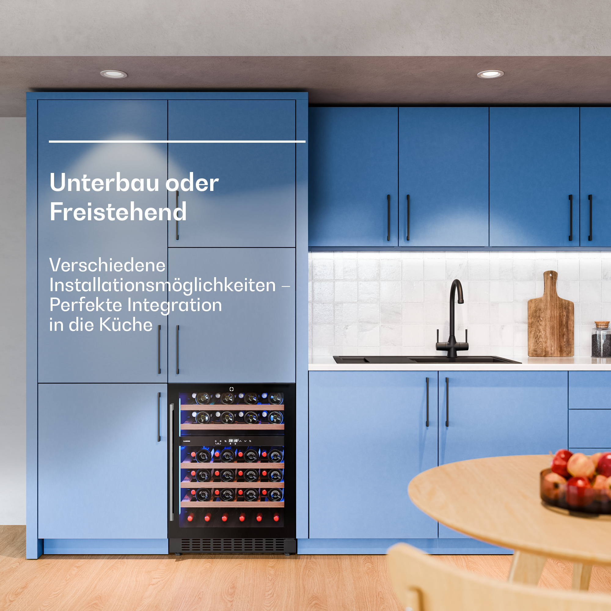 Mobili da cucina blu con cantinetta integrata e tavolo.