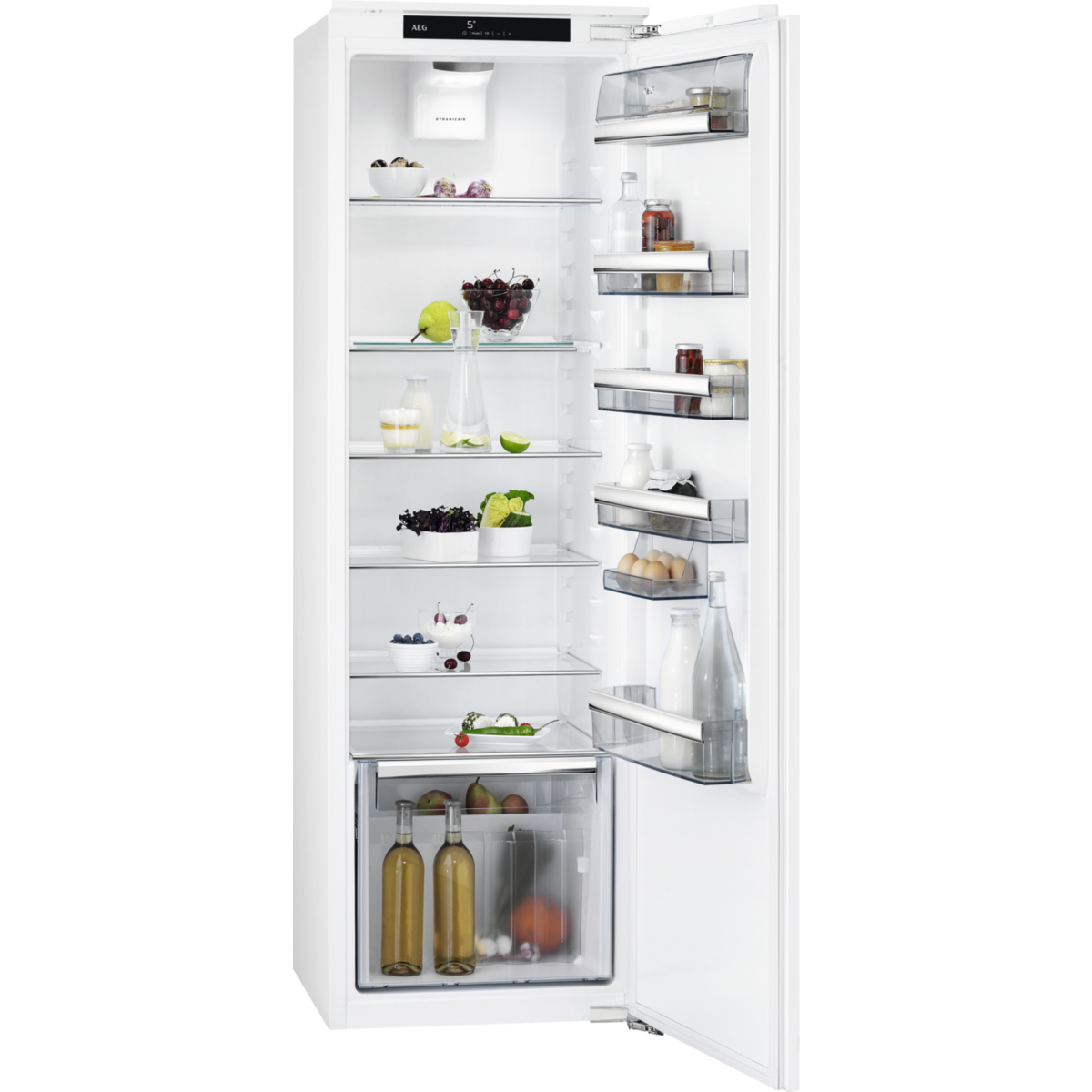 Un refrigerador abierto con alimentos: frutas, huevos, botellas y más.