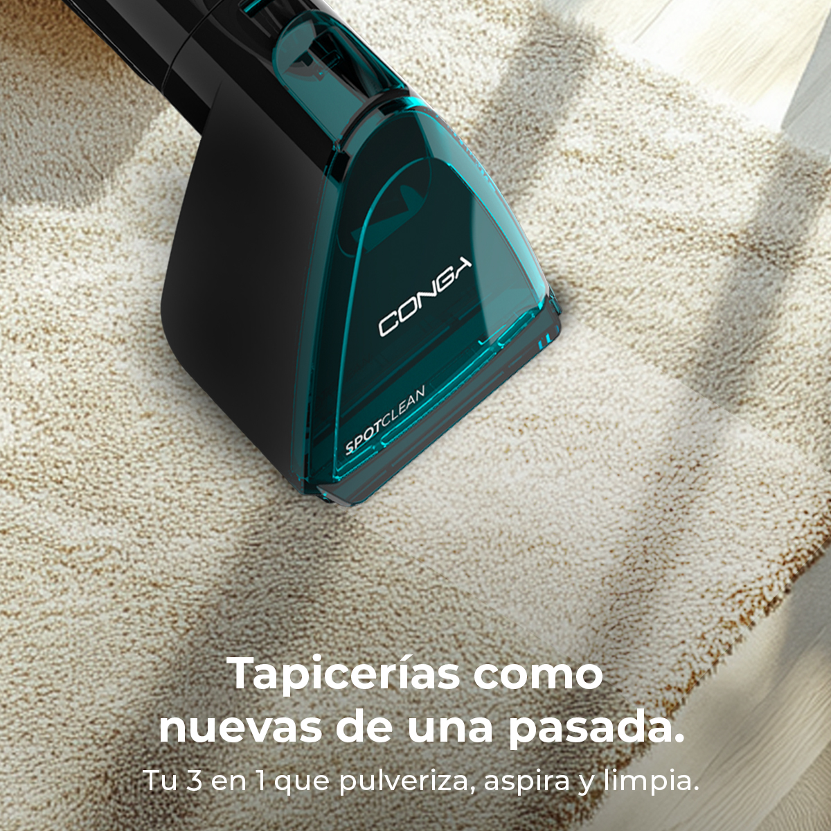 Un limpiador de alfombras Conga Spotclean negro y turquesa sobre una alfombra beige.