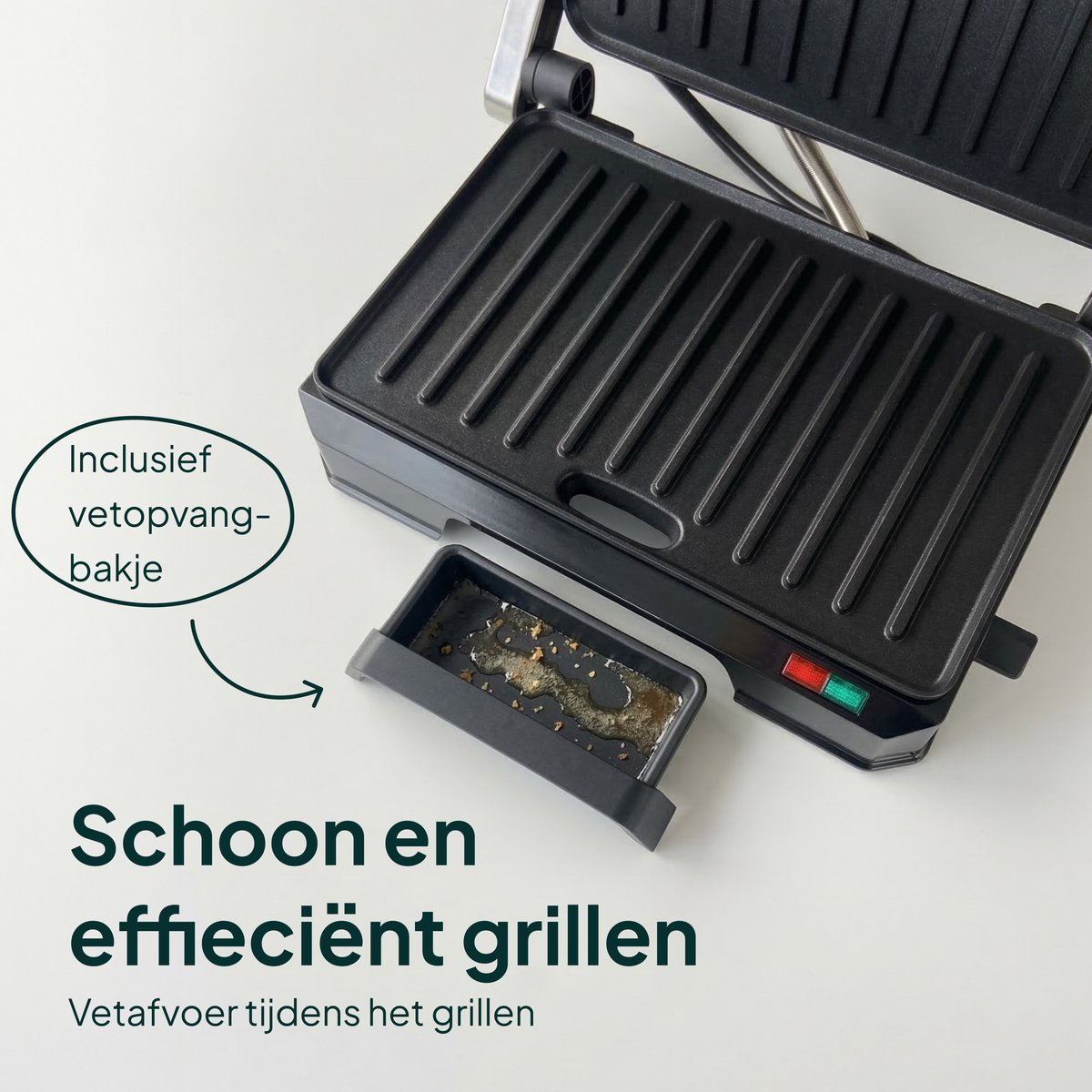 Black contact grill with a removable drip tray containing grease.
