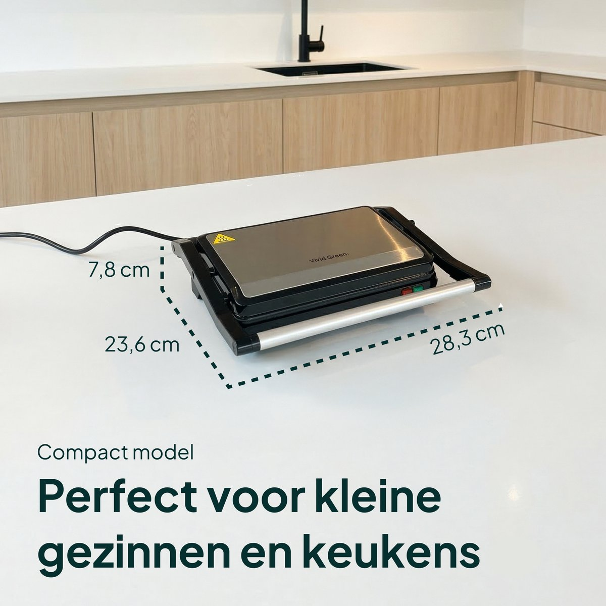 A compact Vivid Green sandwich maker on a white countertop.