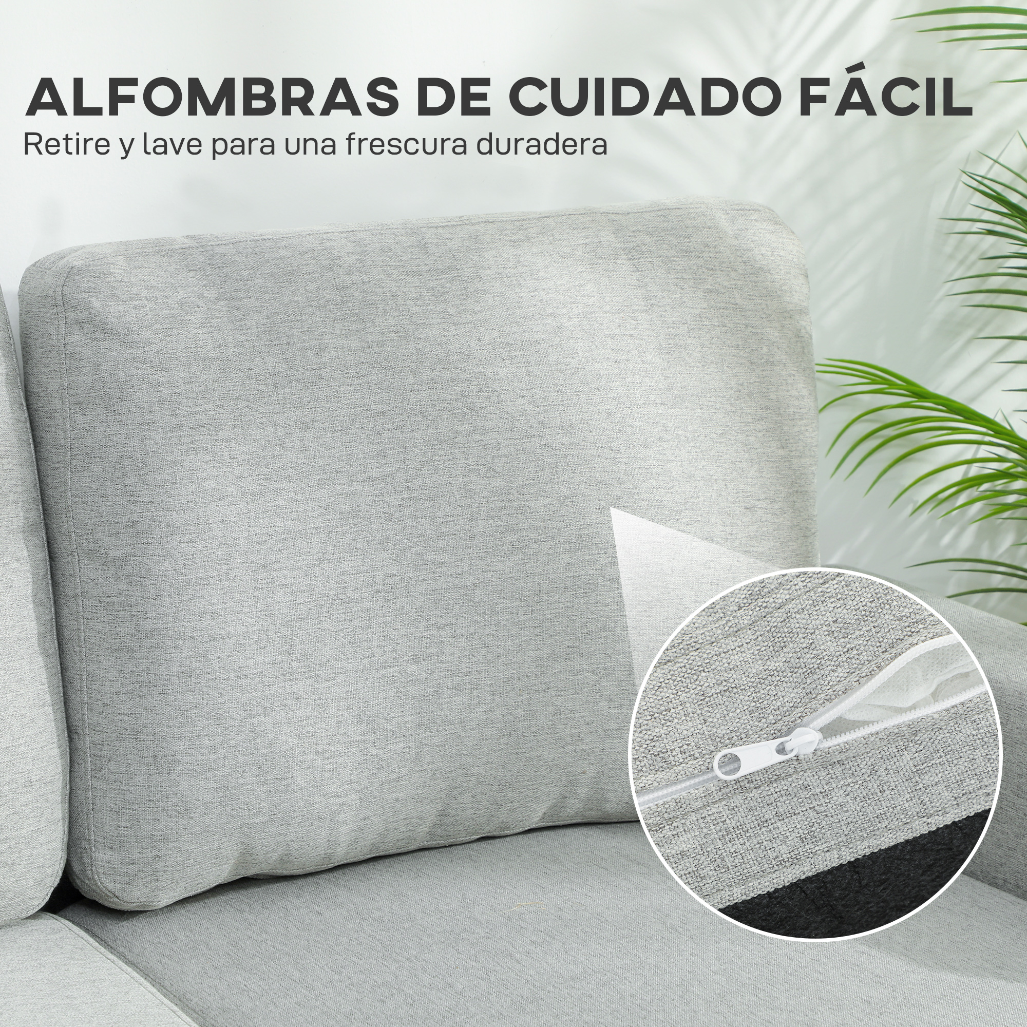 Sofá gris con funda extraíble y cremallera, rodeado de plantas.