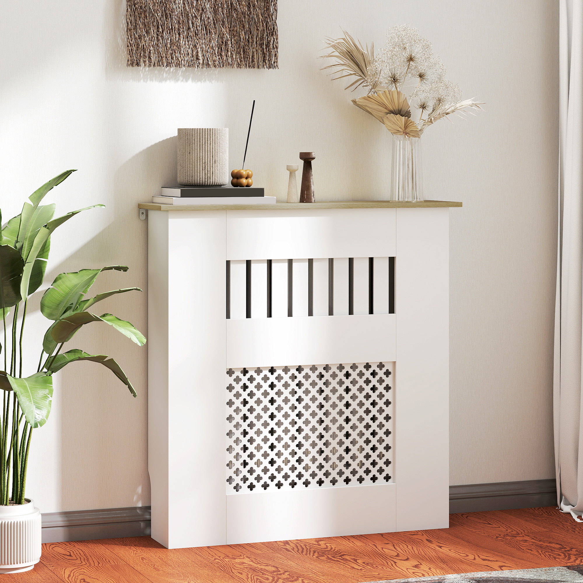 Un armario blanco para radiador con rejillas decorativas y plantas.