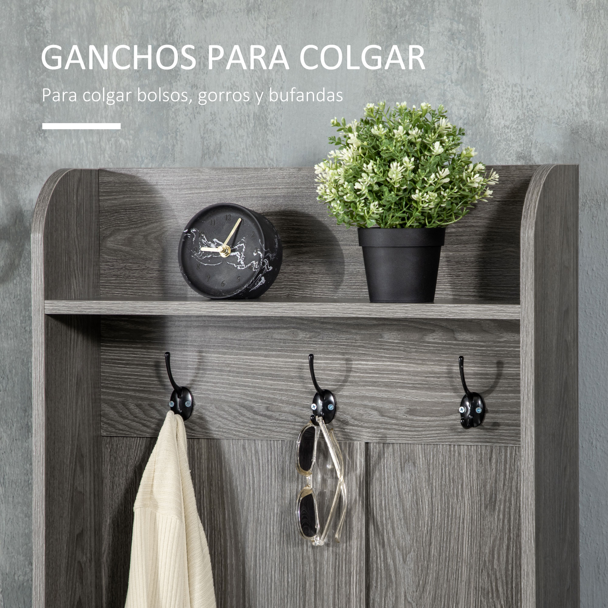 Estante gris con ganchos, cuelga un suéter y unas gafas de sol.