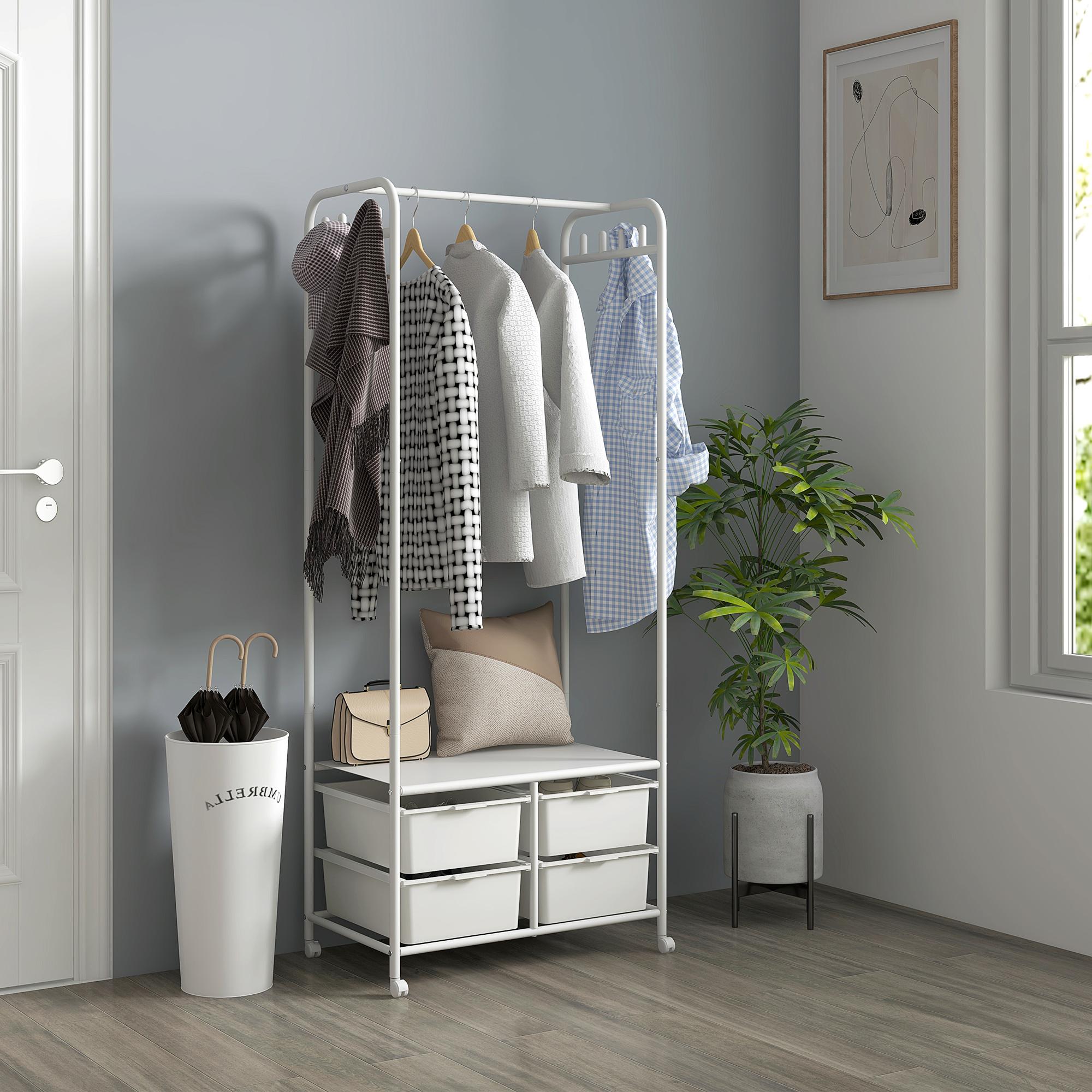 Un perchero blanco con ropa, una planta y una ventana.