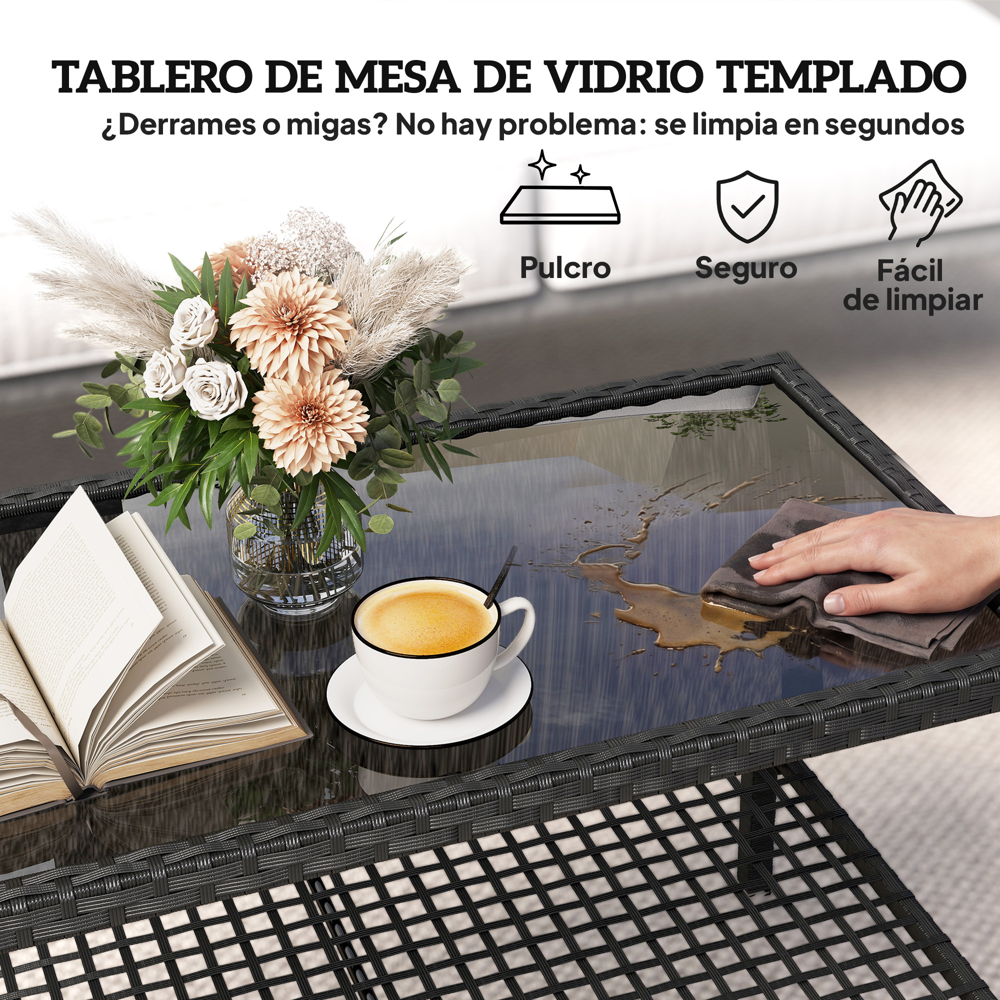 Mesa de cristal templado con flores, libro y café. Una mano limpia un derrame.