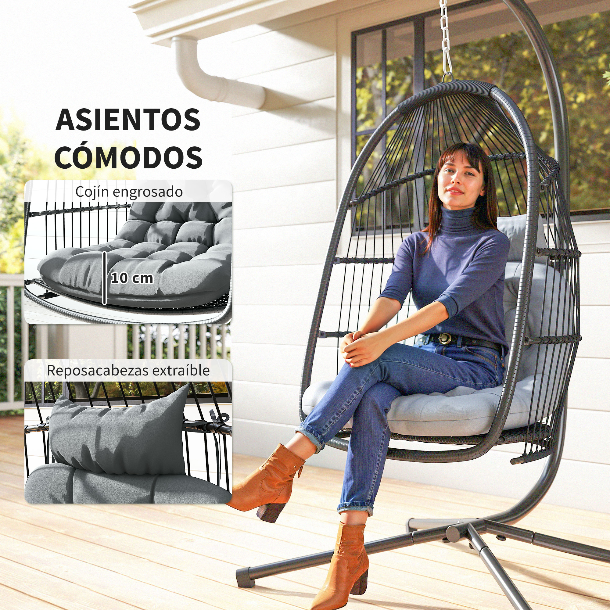 Mujer sentada en una silla colgante de mimbre con cojines grises en un porche.