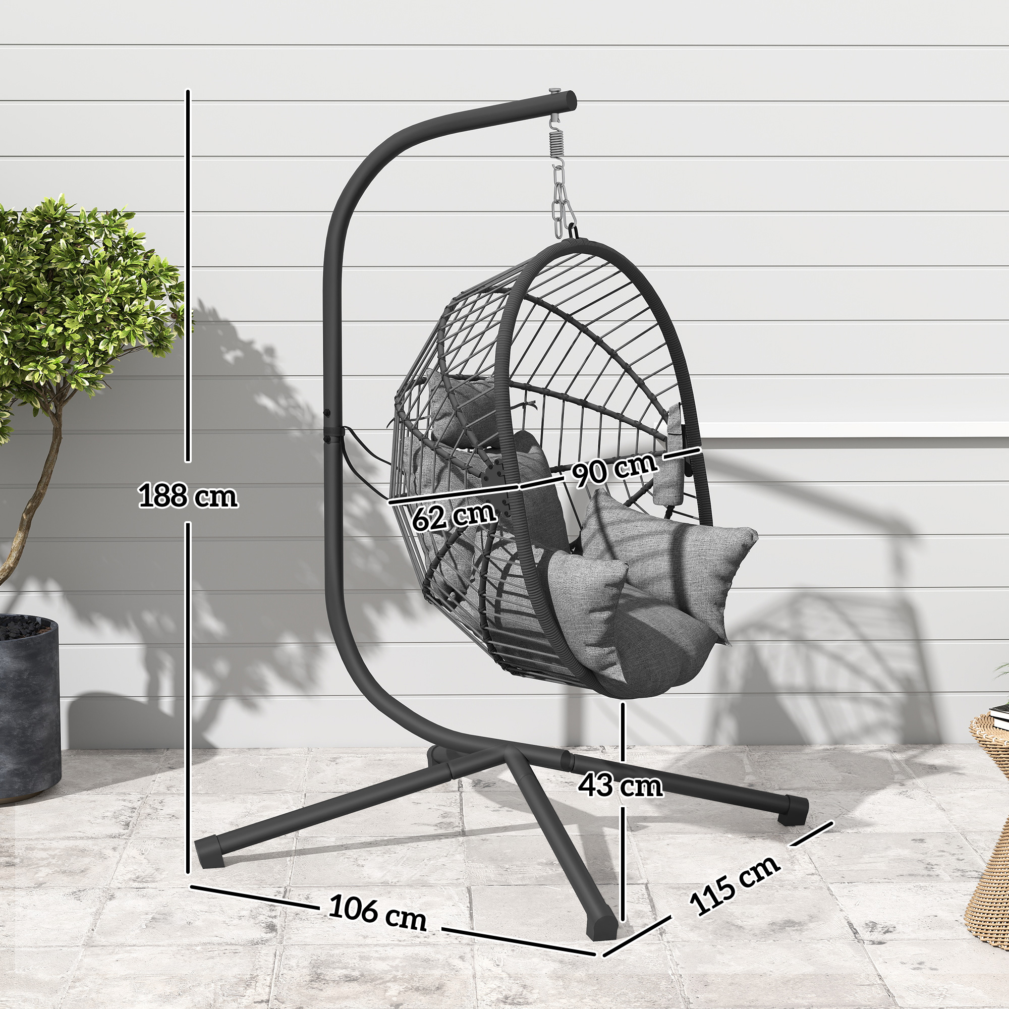 Silla colgante negra tipo huevo con cojines sobre soporte, se indican dimensiones.
