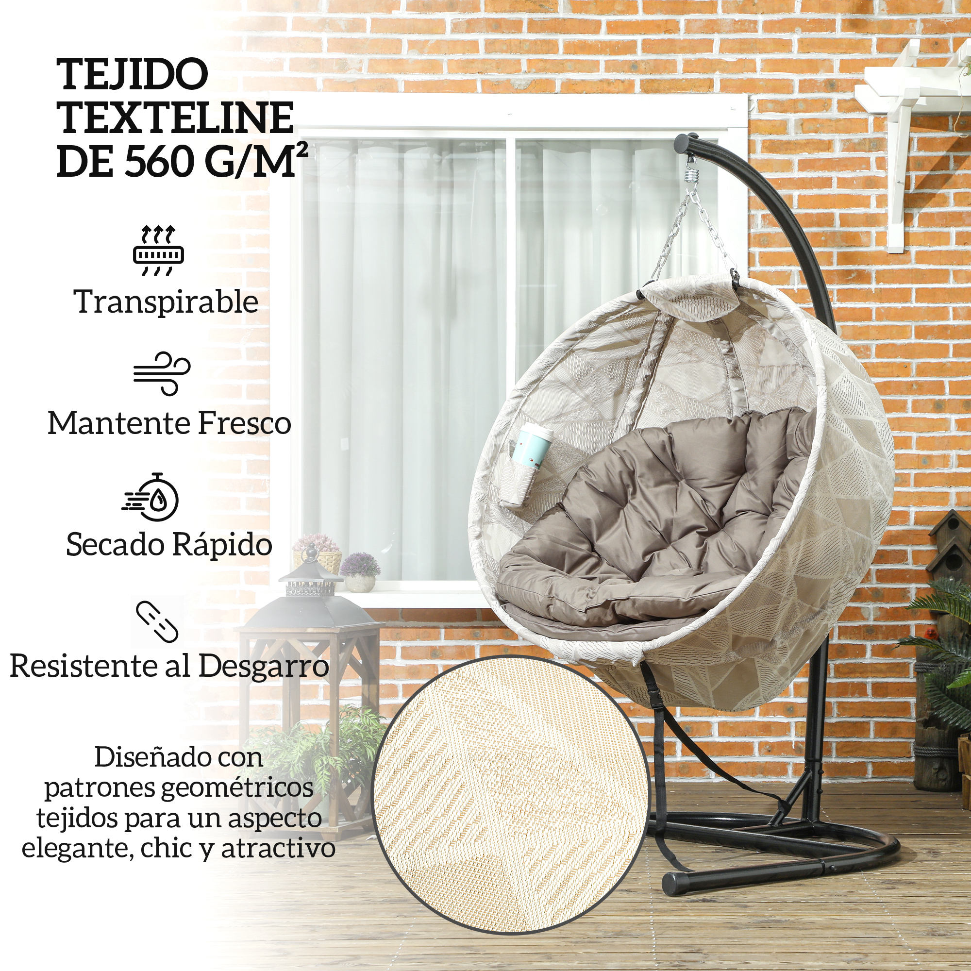 Un sillón colgante tipo cesta con cojines frente a una pared de ladrillos.