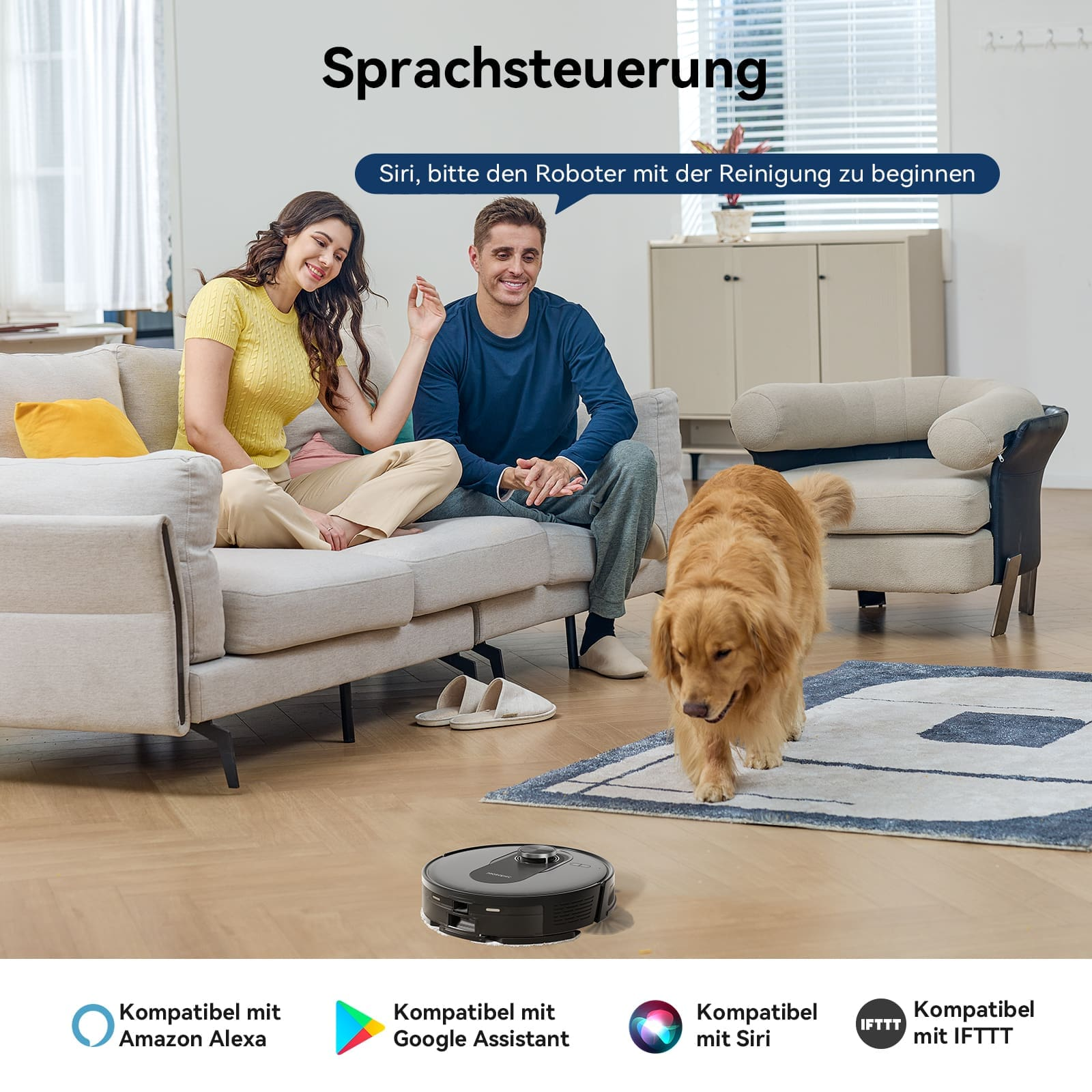 Una pareja sentada en un sofá con un perro y un robot aspirador.