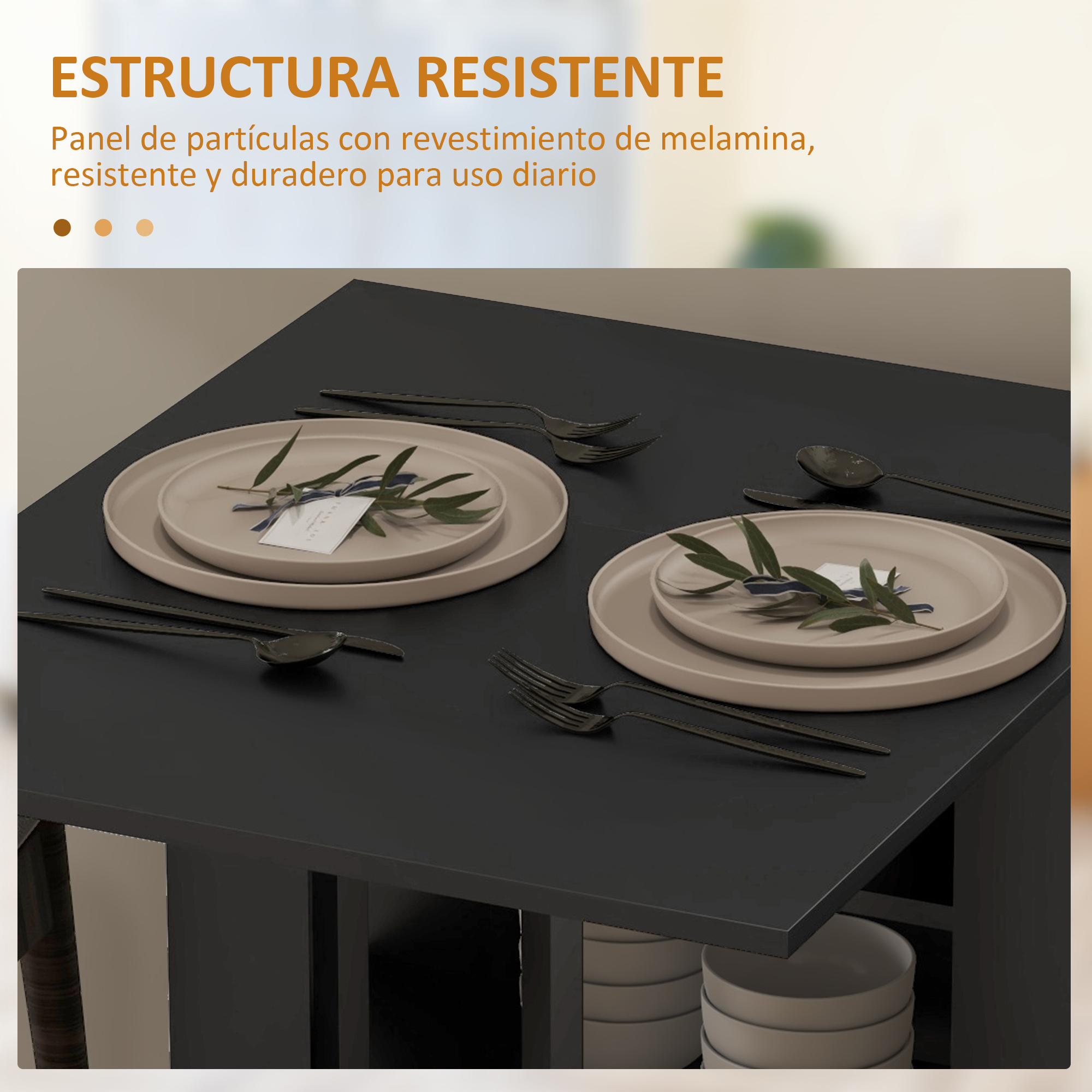 Una mesa negra está puesta con platos, cubiertos y ramas de olivo.