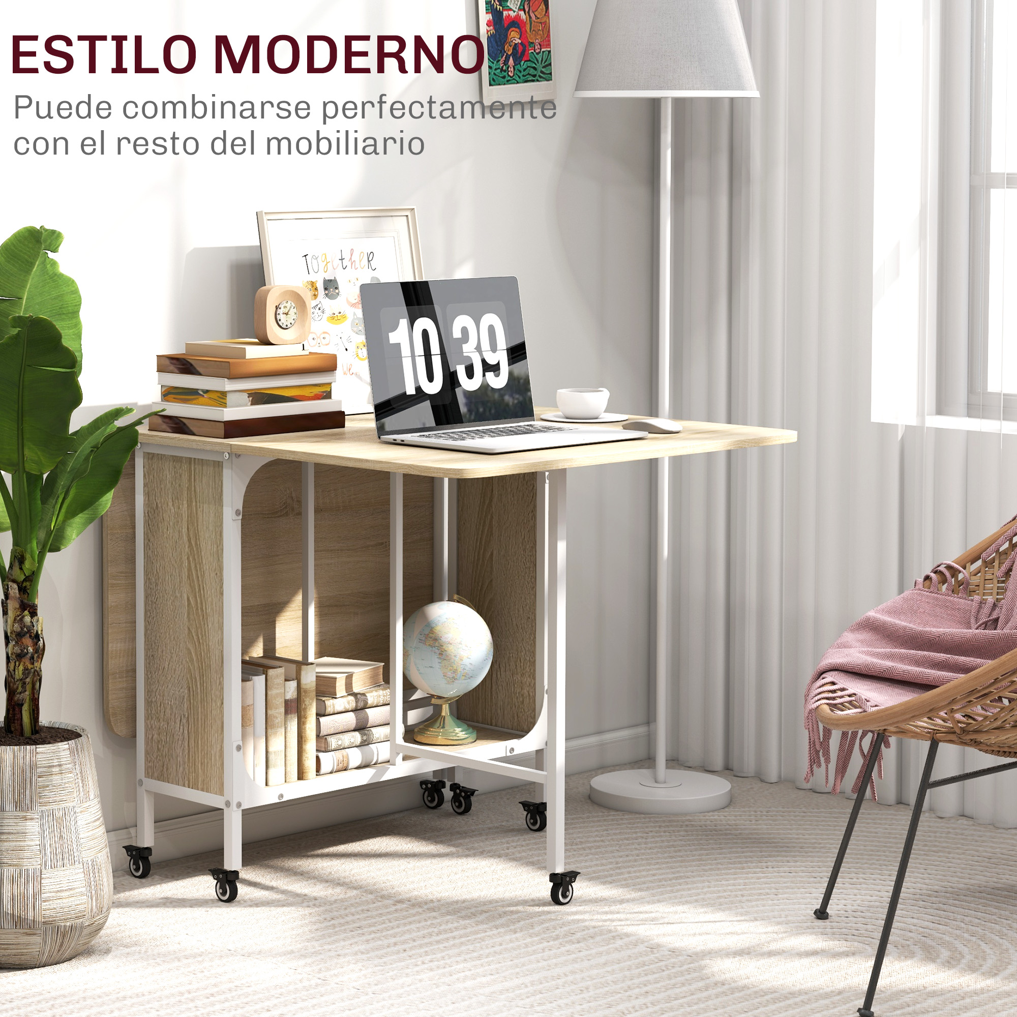Mesa de madera con portátil, libros y globo, junto a sillón con manta.