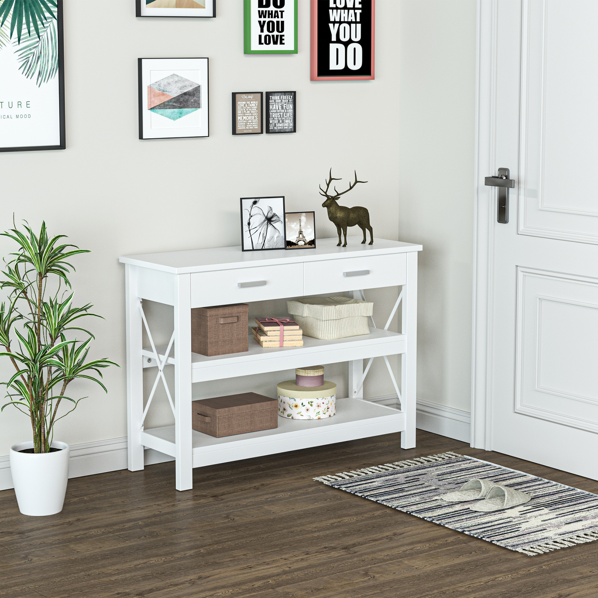 Una mesa consola blanca con decoración, plantas y una puerta.
