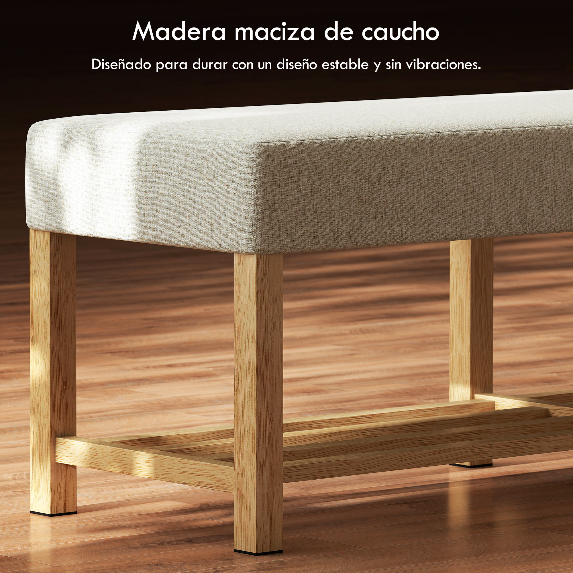 Un banco tapizado beige con patas de madera sobre suelo de madera.