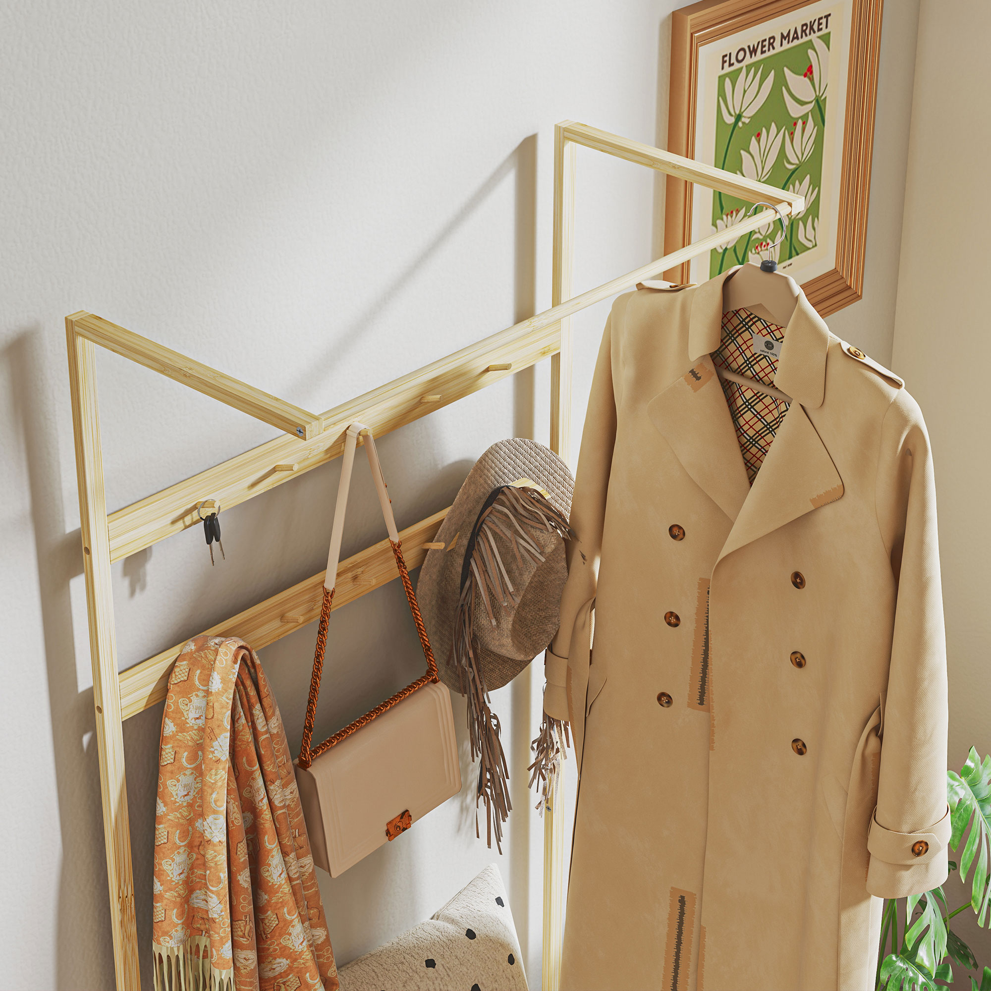 Un abrigo beige, sombrero, bolso y bufanda cuelgan de un perchero de madera.