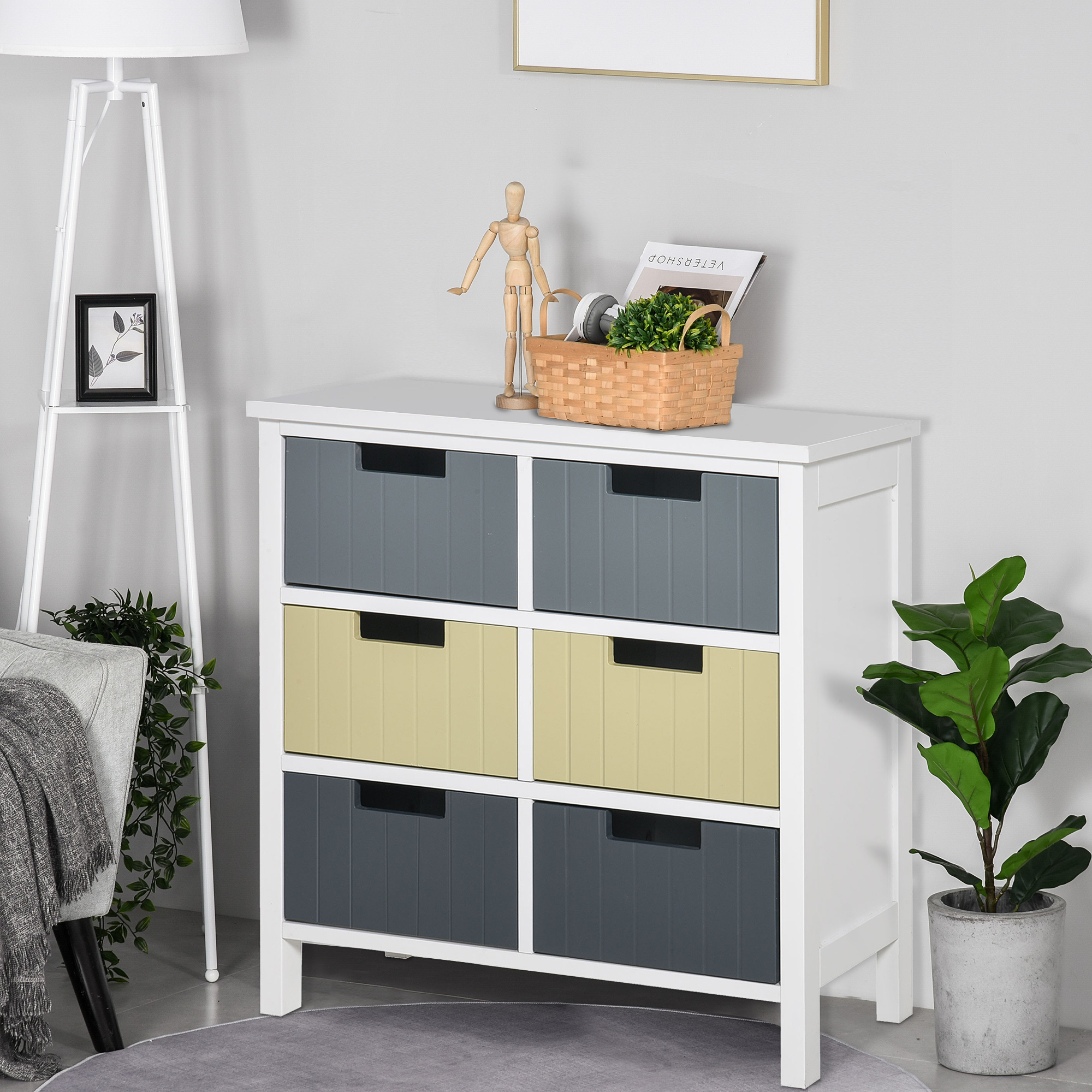 Una cómoda blanca con seis cajones en gris y amarillo.