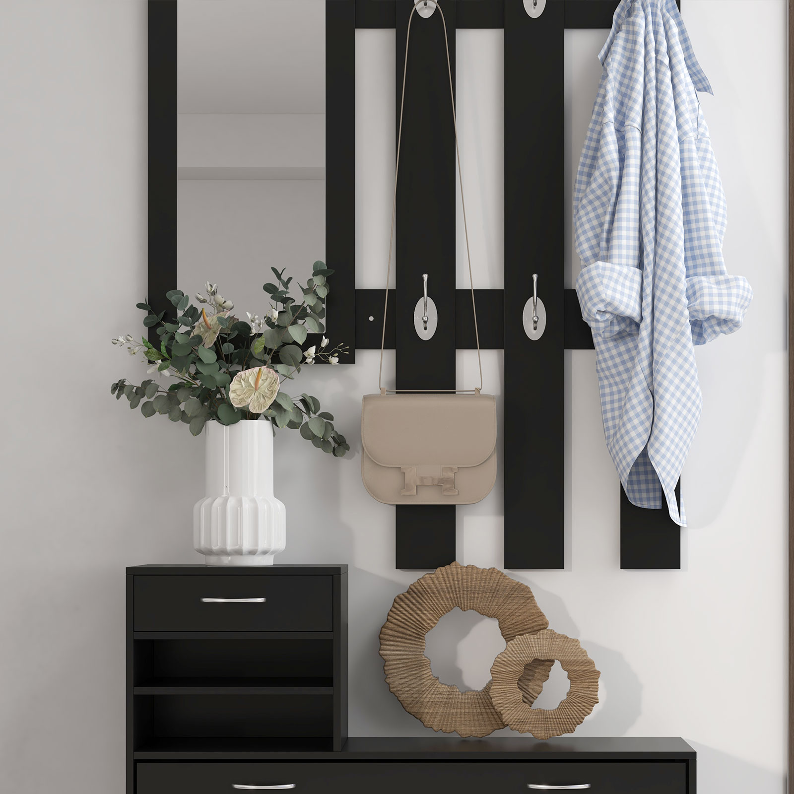 Un perchero negro con espejo, bolso, camisa, jarrón y coronas decorativas.