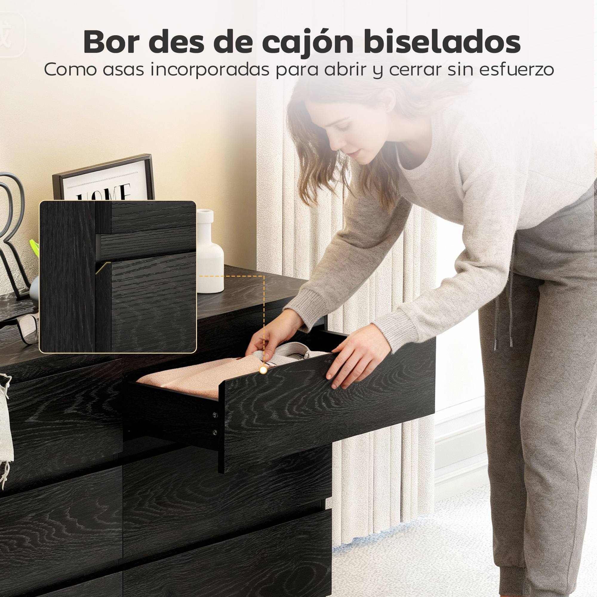 Una mujer abre un cajón de madera oscura que contiene ropa.