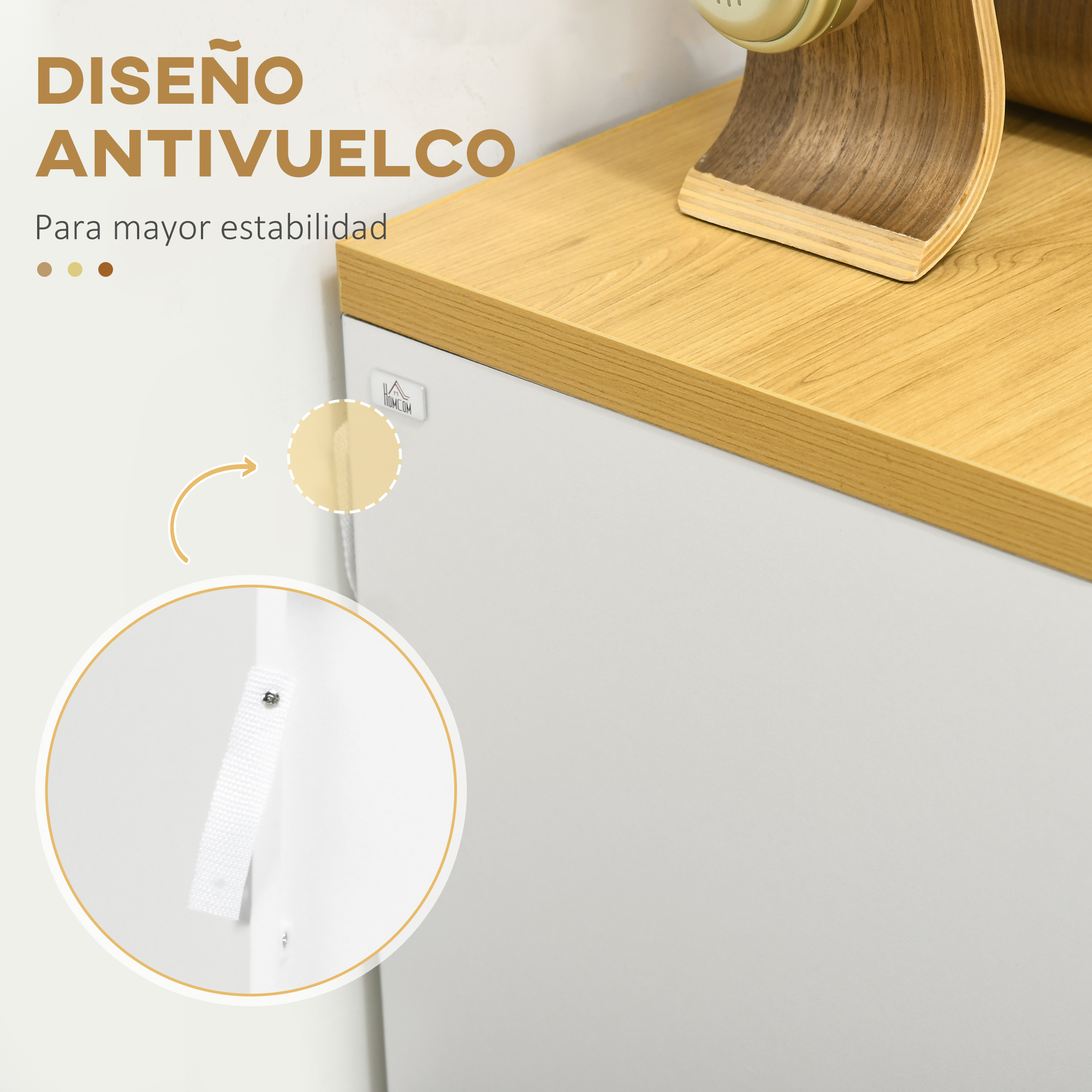 Diseño antivuelco con correa de sujeción y tornillo en mueble blanco.