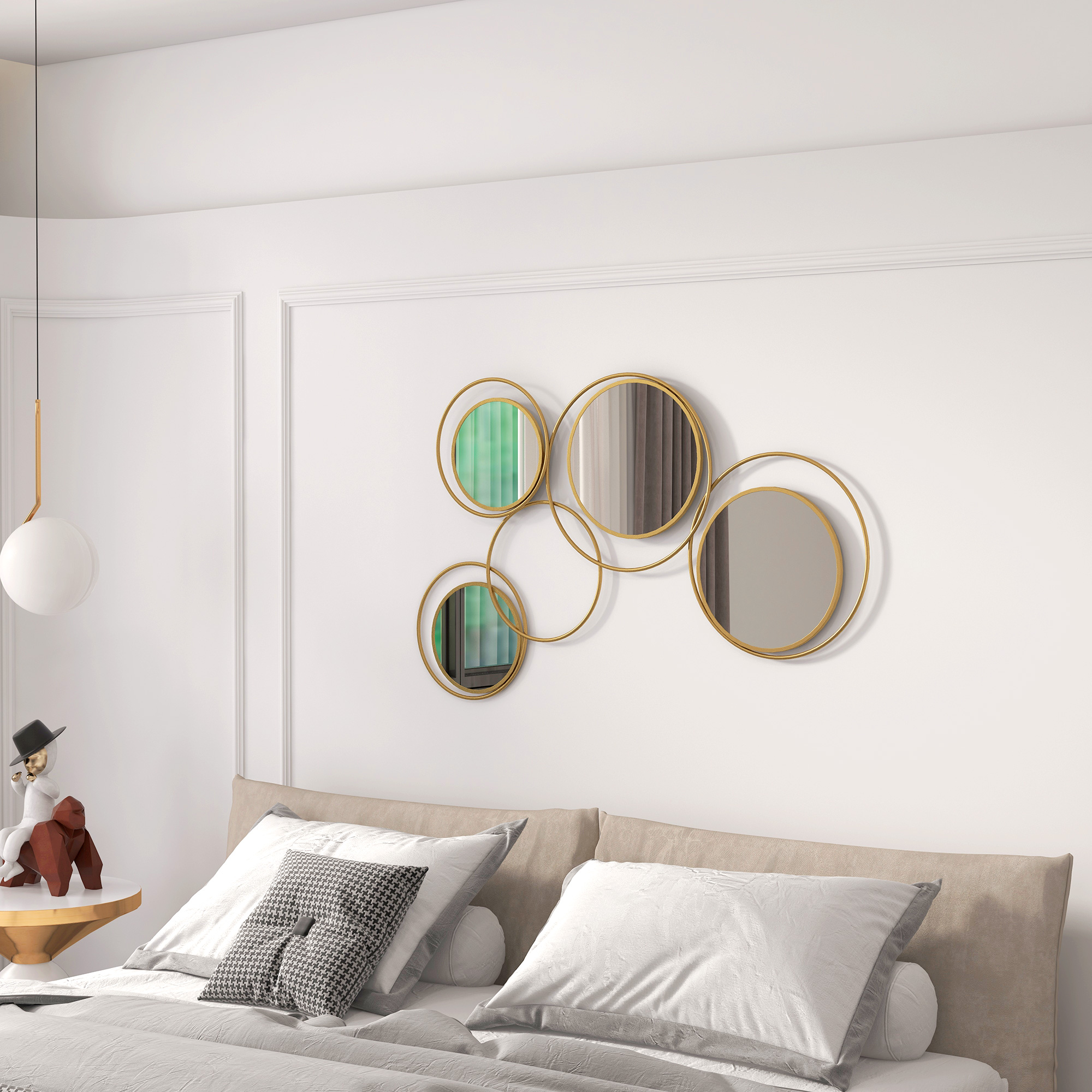 Un dormitorio moderno con cama, cojines decorativos y espejos circulares en la pared.