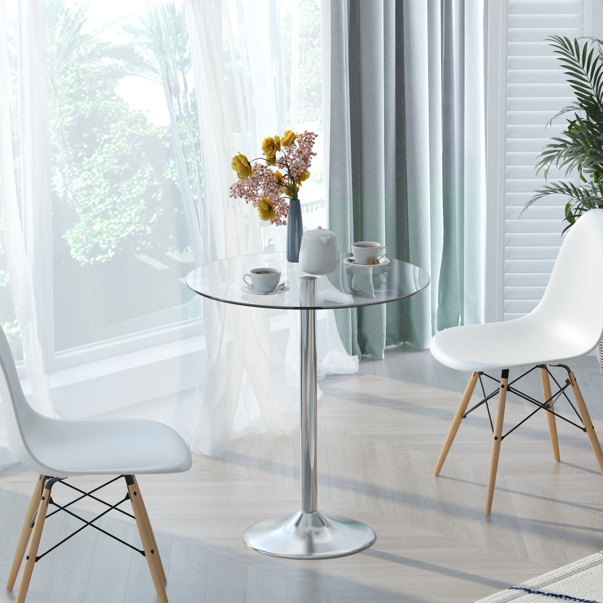 Dos sillas blancas flanquean una mesa redonda de cristal con café.
