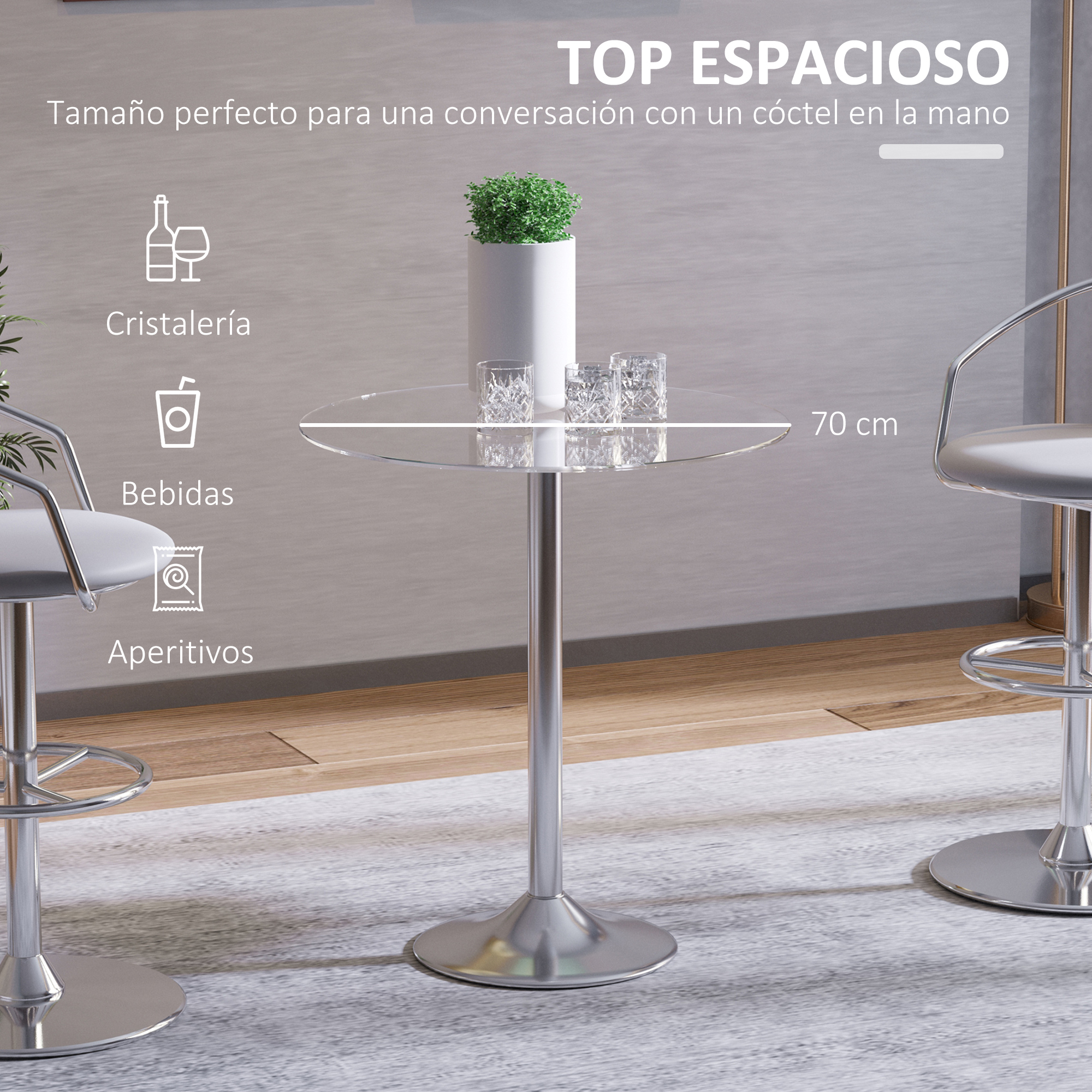 Mesa redonda de cristal con base plateada y taburetes.