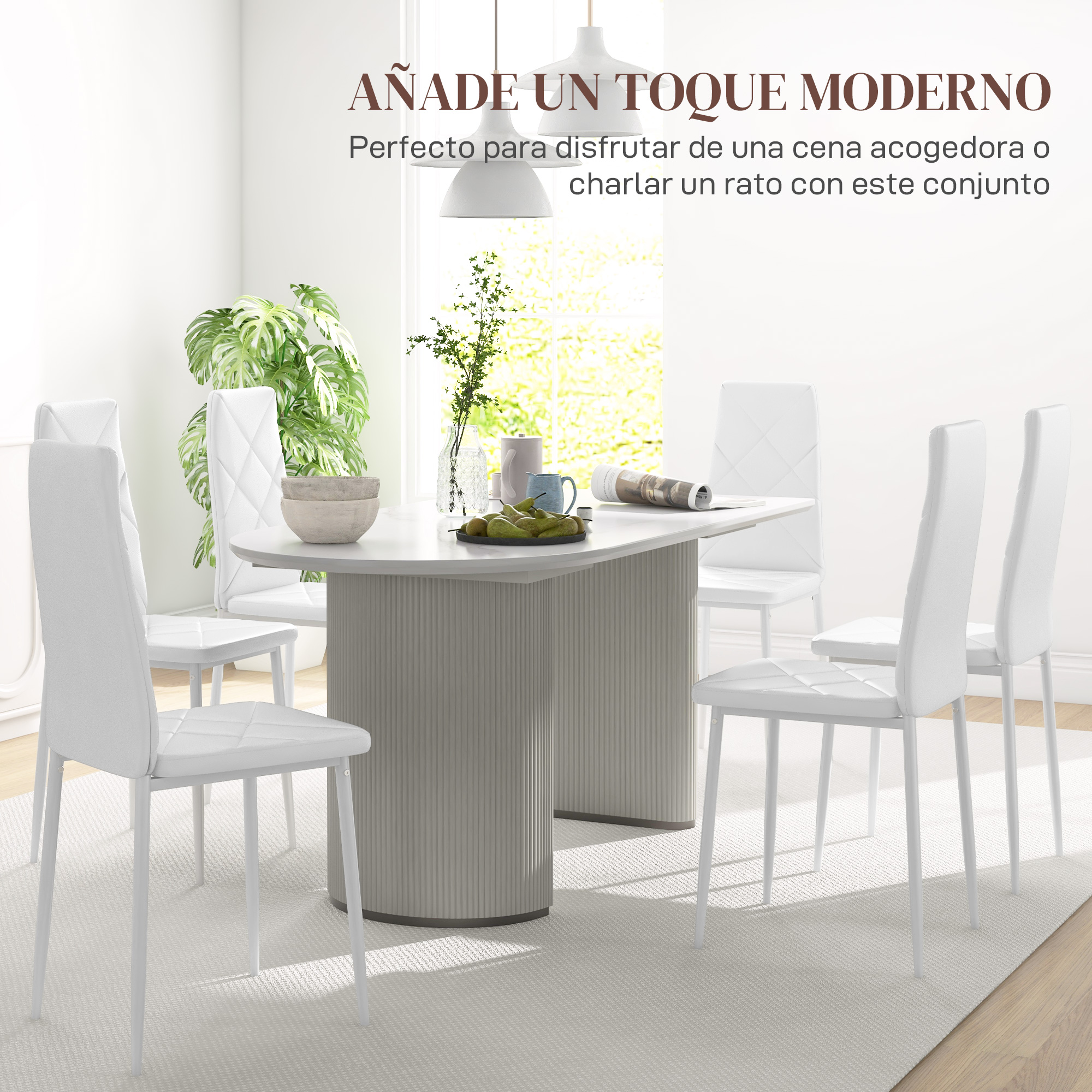 Un juego de comedor moderno con sillas blancas alrededor de una mesa con fruta.