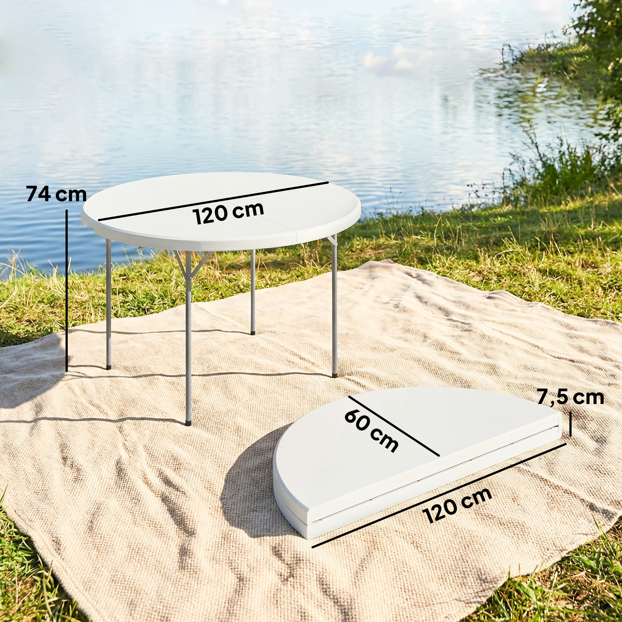 Una mesa plegable redonda blanca está sobre una manta junto al agua.