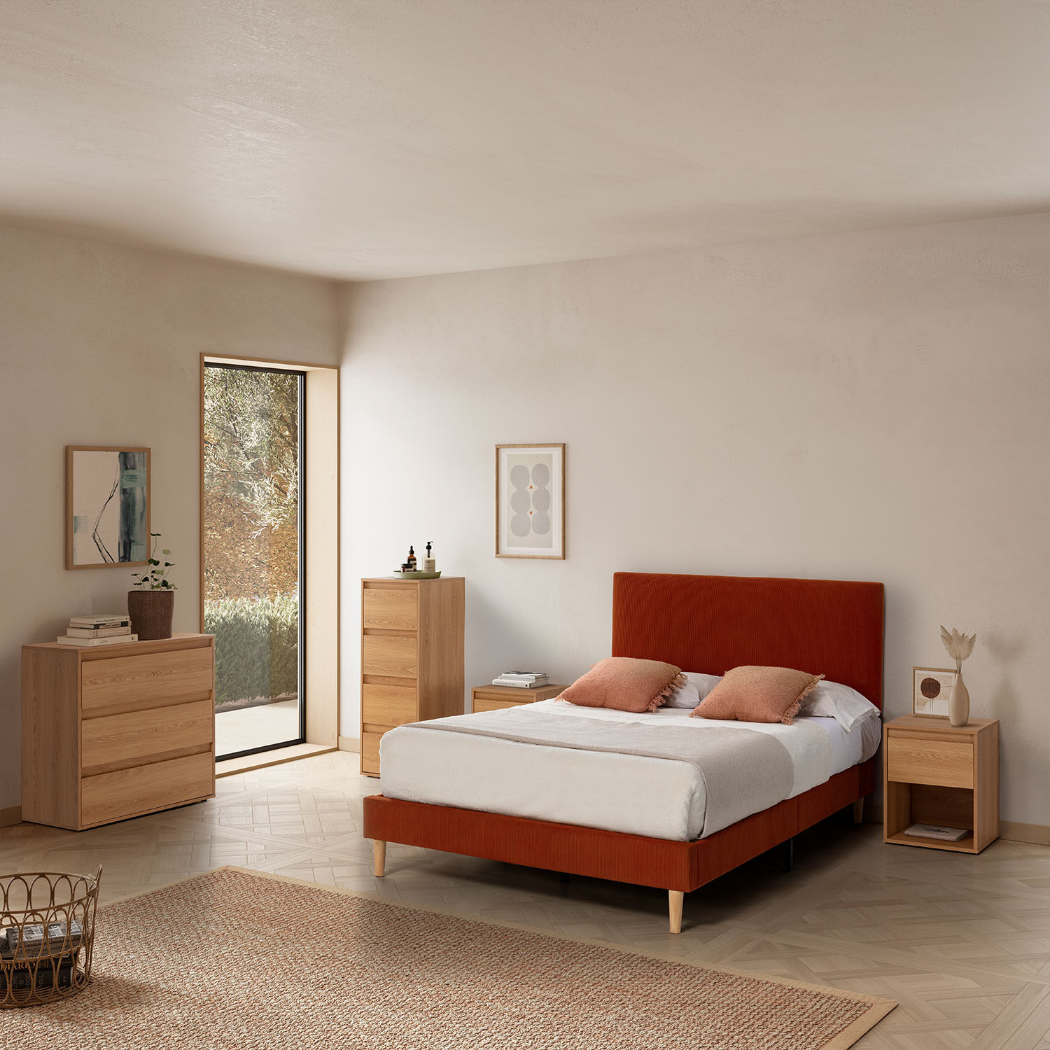 Un dormitorio con cama naranja, muebles de madera y una ventana grande.