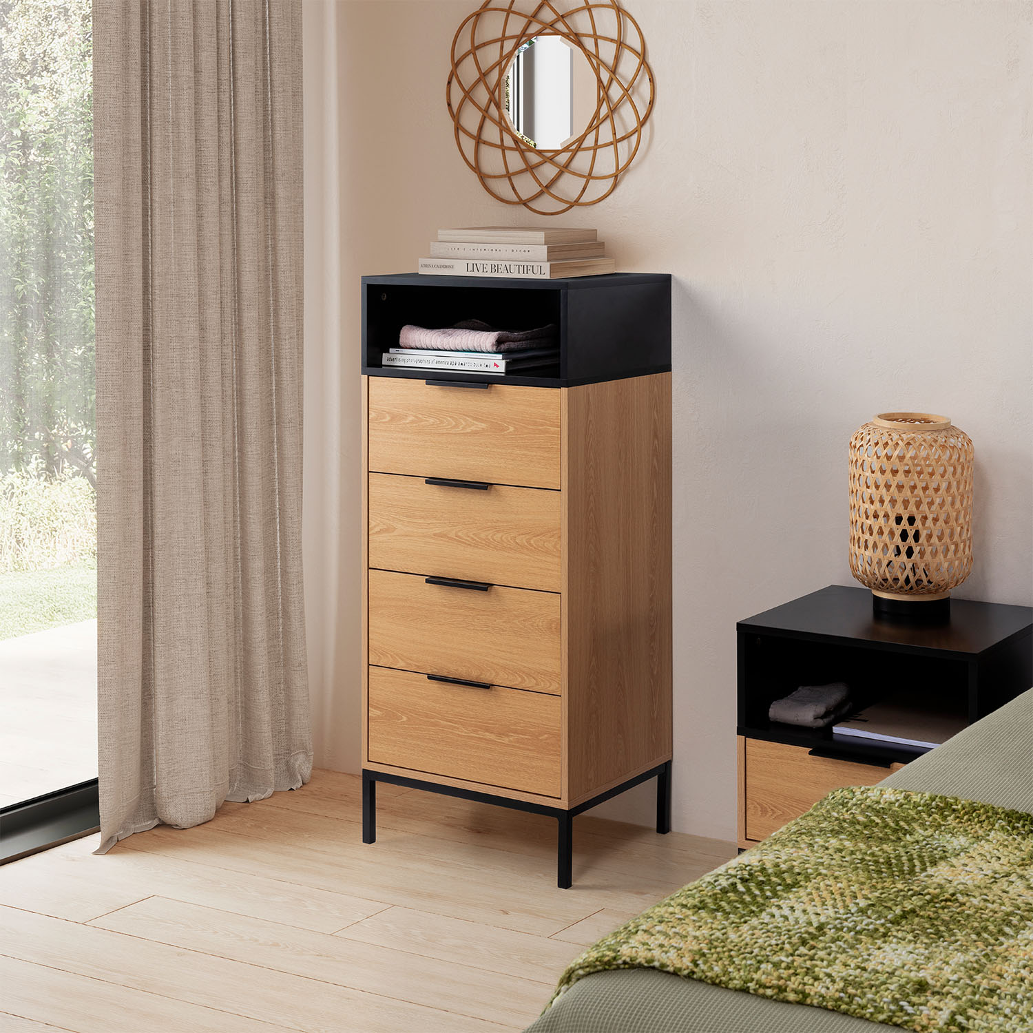 Un dormitorio con suelo de madera, cortina, cómoda, mesita de noche y cama.