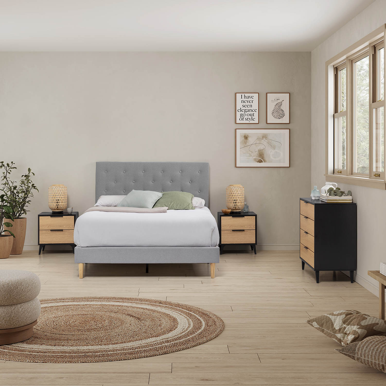 Un dormitorio con cama gris, mesitas de noche, cómoda y alfombra redonda.