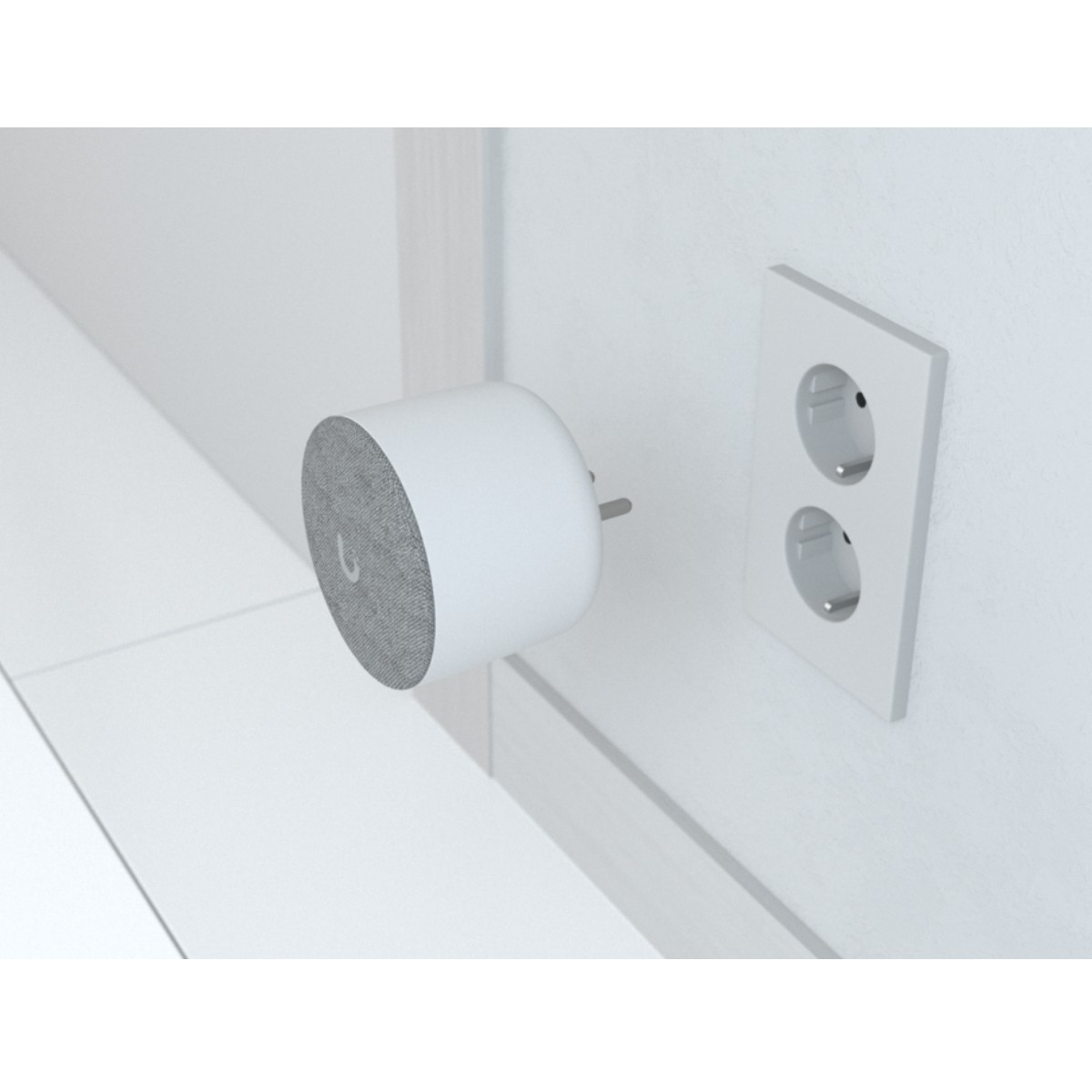A white smart speaker with grey fabric plugged into a wall socket.