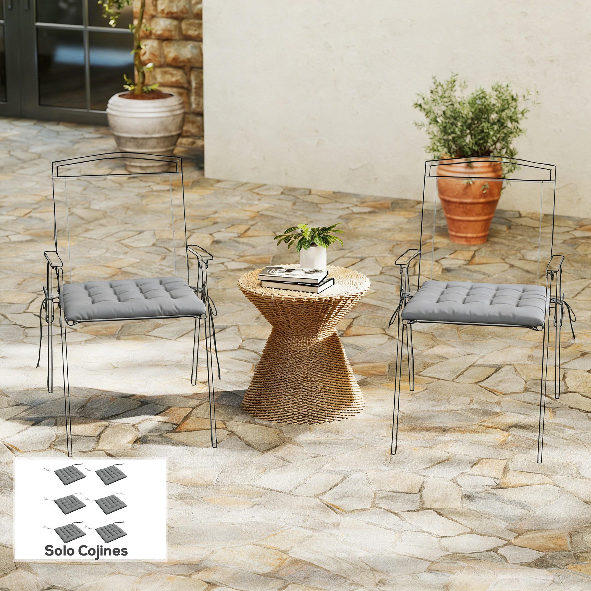 Dos cojines grises para sillas en un patio embaldosado con una mesa pequeña.