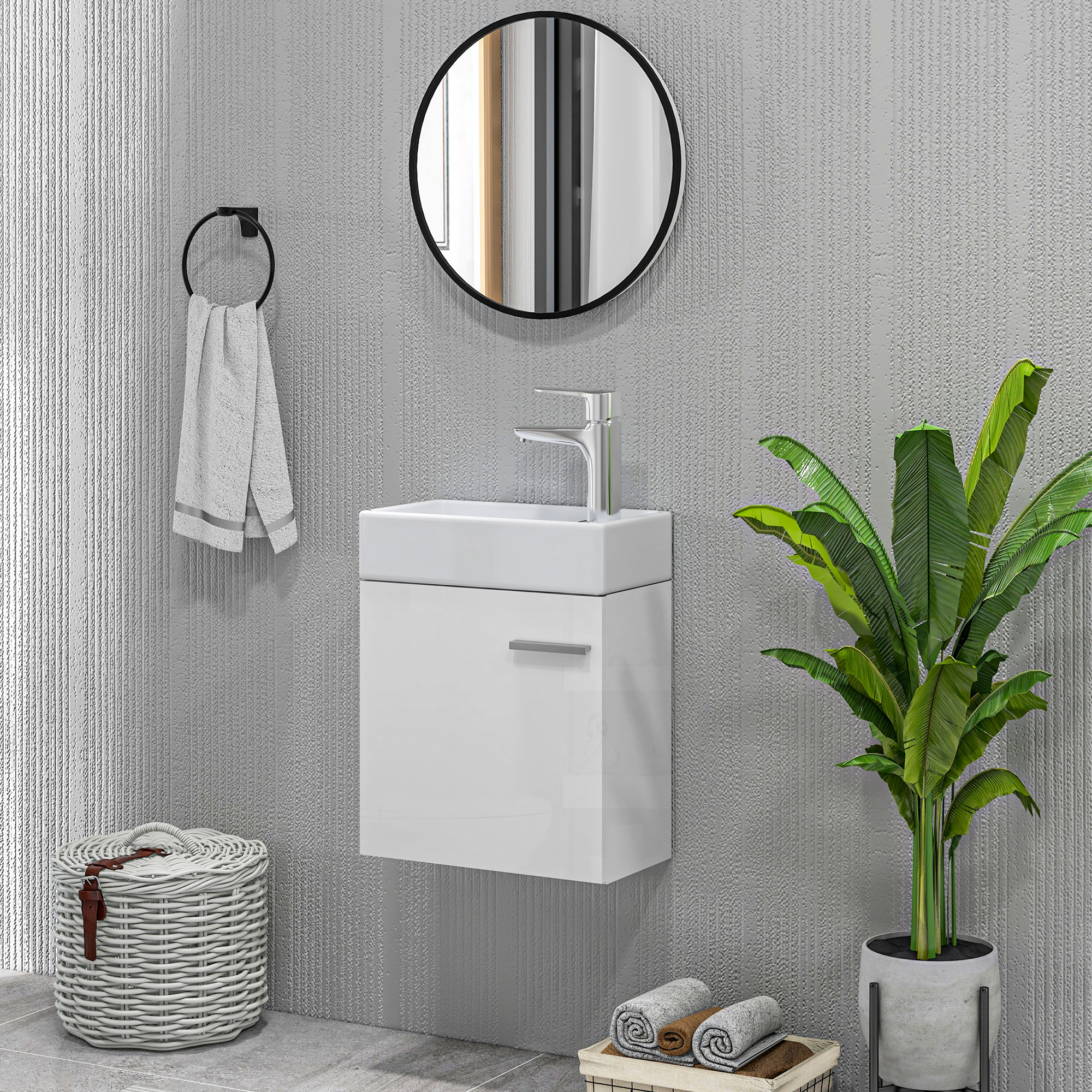 Baño moderno con tocador blanco, espejo y planta.