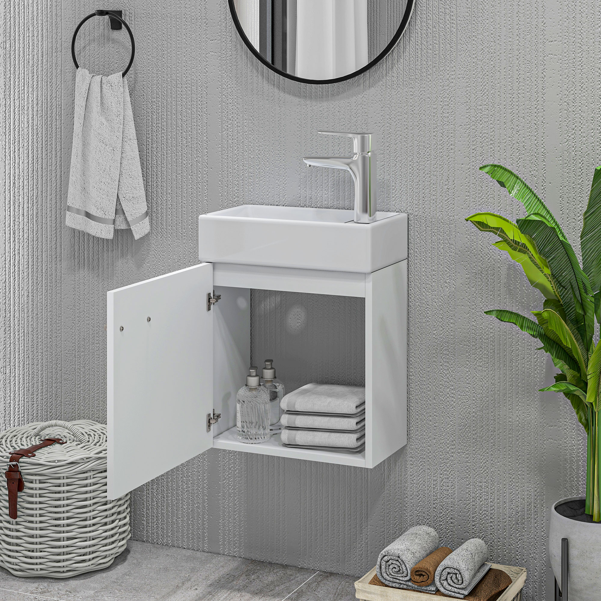 Un baño moderno con lavabo blanco, espejo y toallero. Armario abierto muestra toallas.