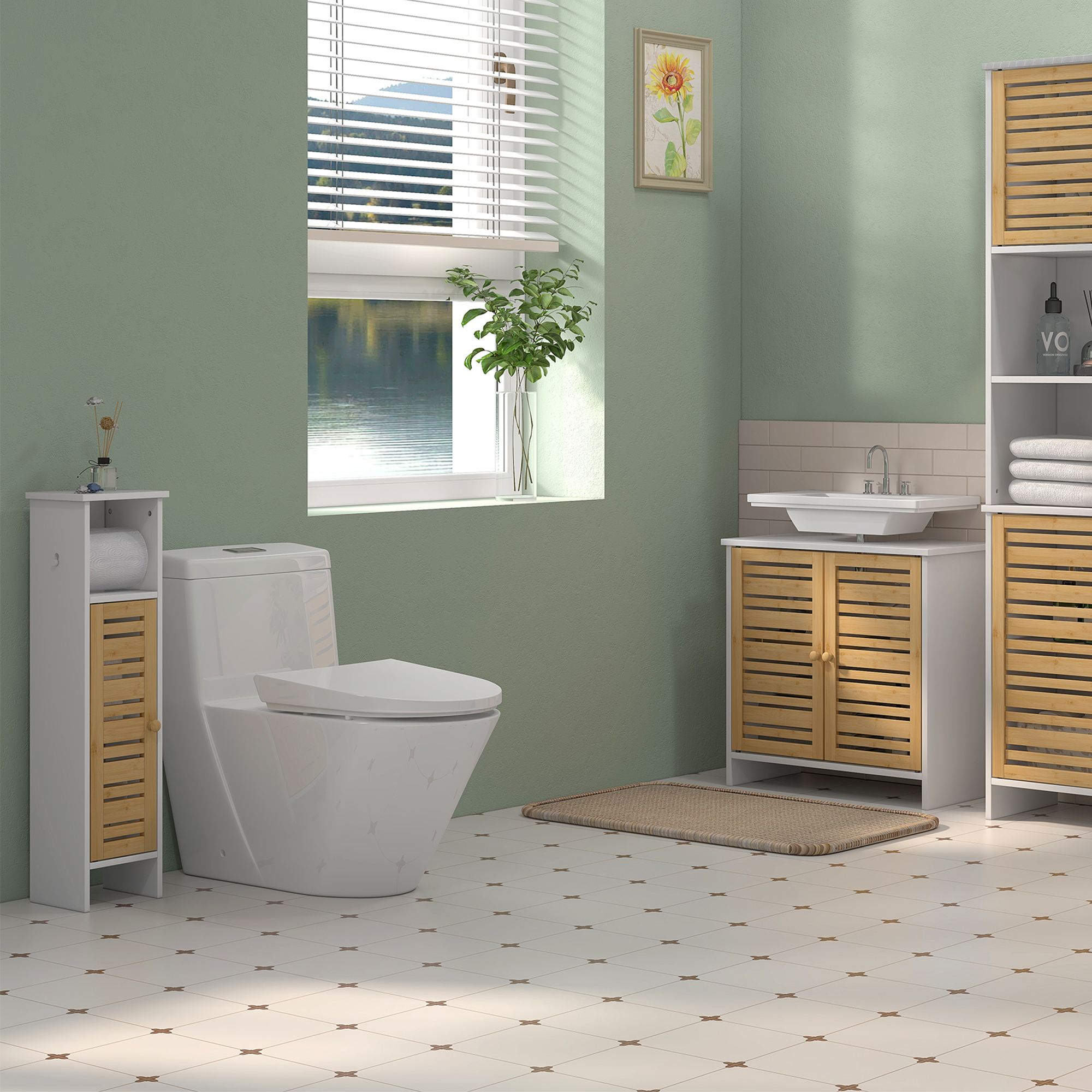 Un baño con inodoro, lavabo, armarios, ventana y cuadro.