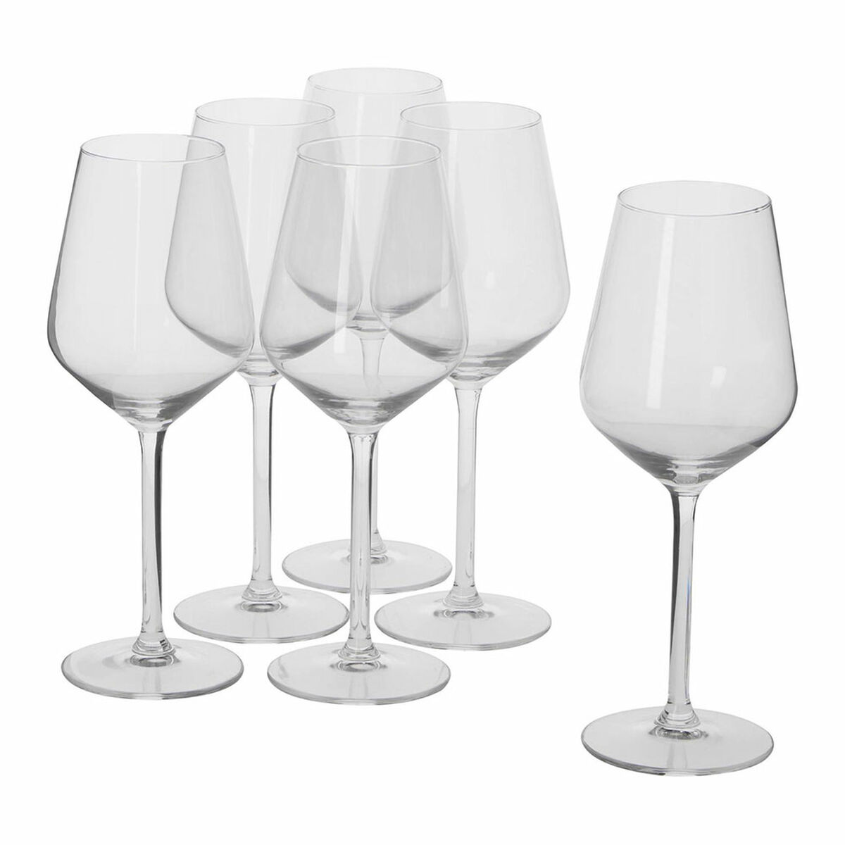 Five clear wine glasses with long stems stand on a white surface.