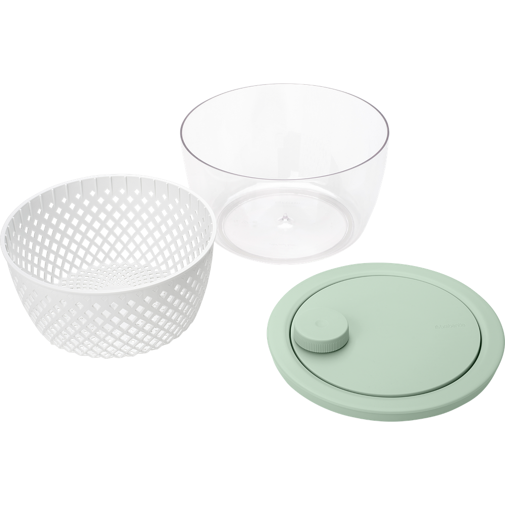 Uno scolapasta bianco, una ciotola trasparente e un coperchio verde.