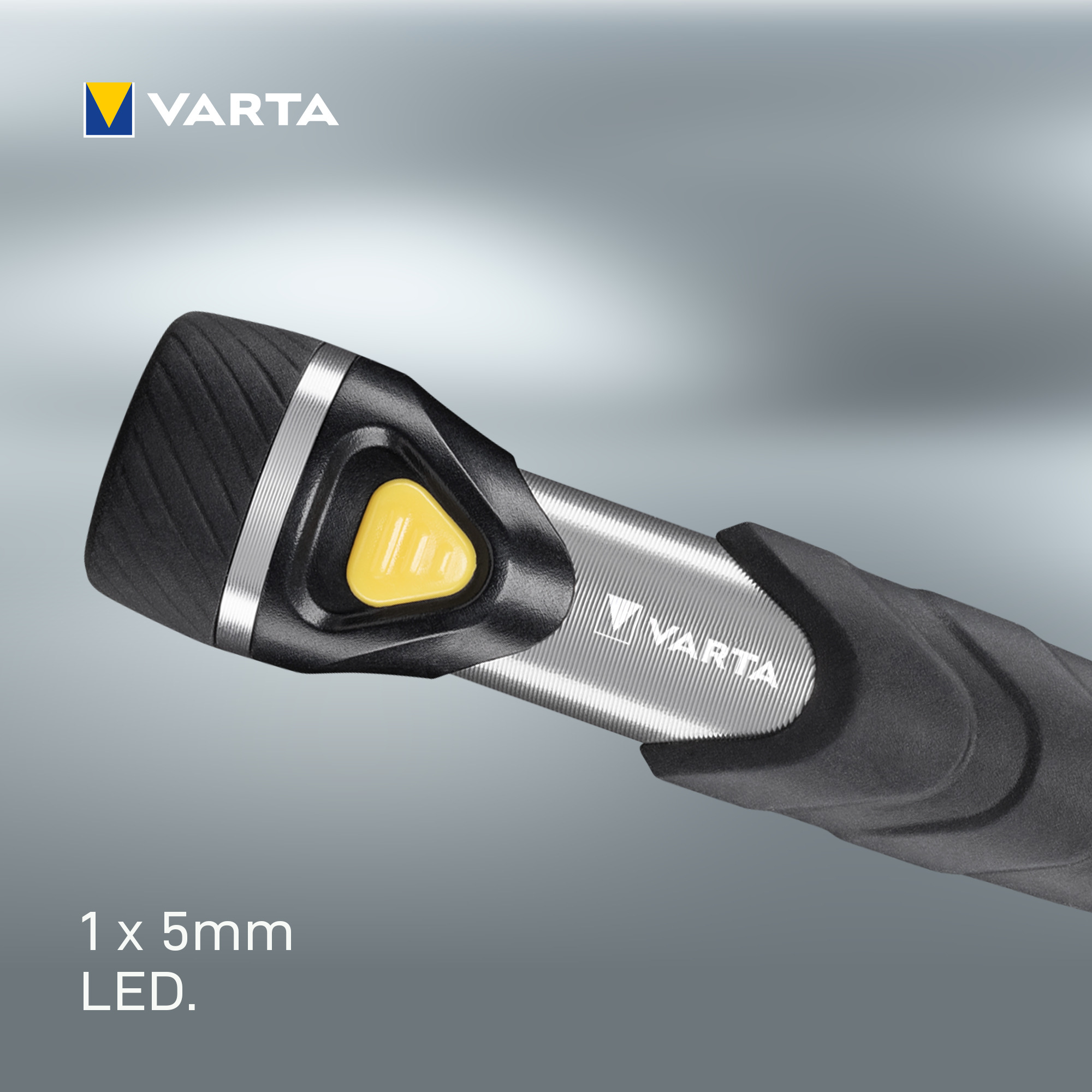 Une poignée de stylo Varta noire avec un bouton jaune et une bande argentée.