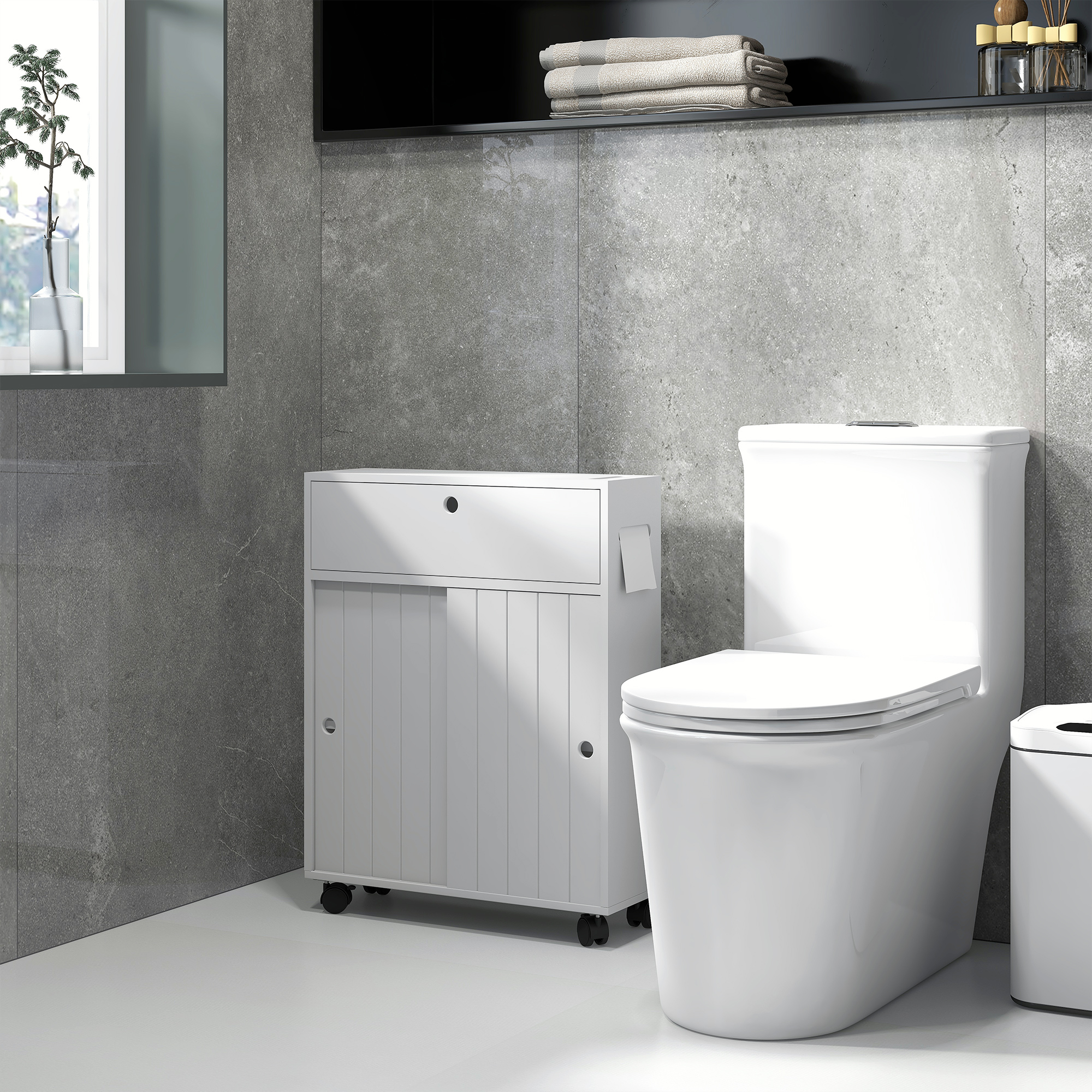 Un inodoro blanco y un mueble blanco con ruedas sobre suelo de baldosas grises.