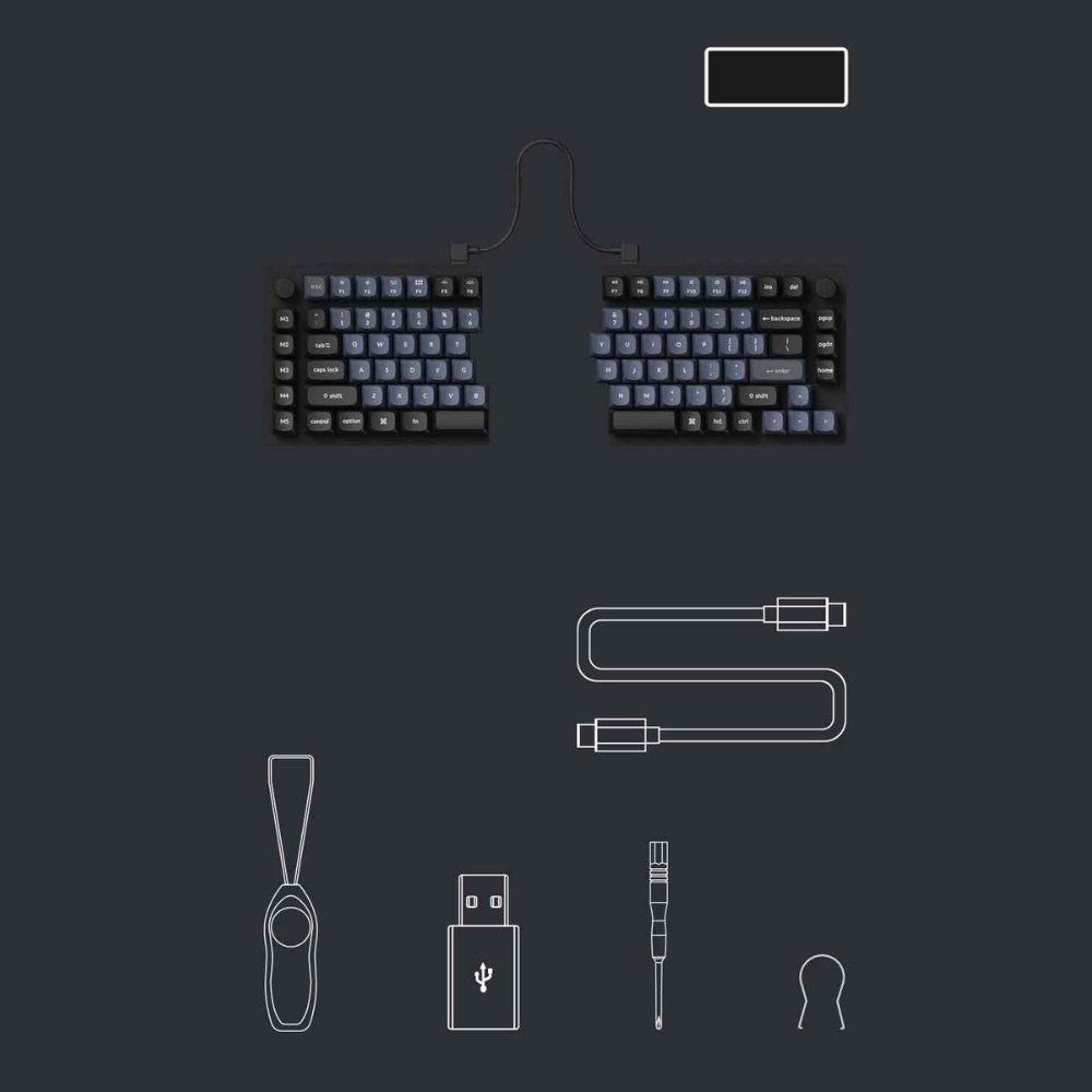 Dzielona klawiatura z kablami i akcesoriami na ciemnym tle.