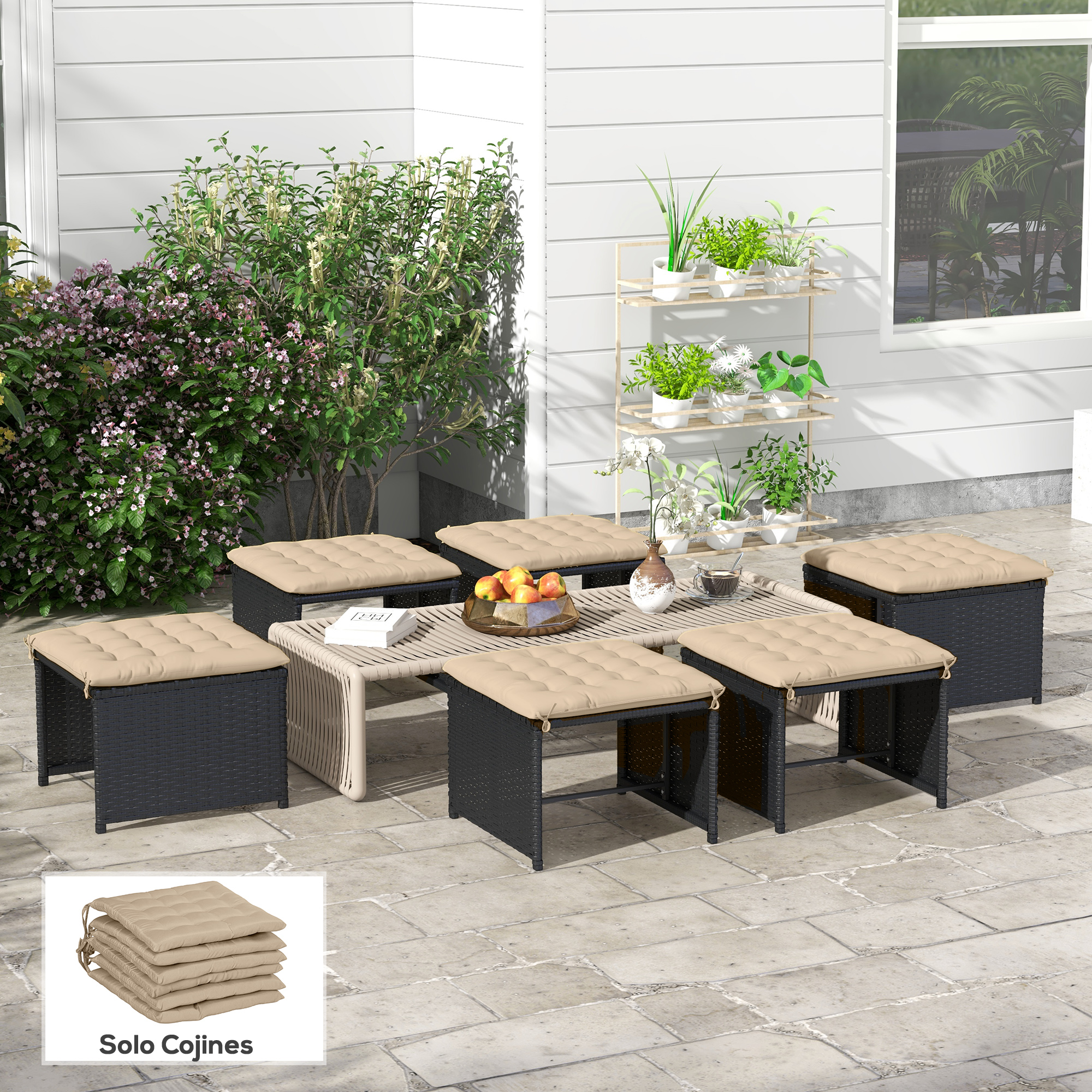 Conjunto de muebles de exterior con mesa, taburetes y cojines.