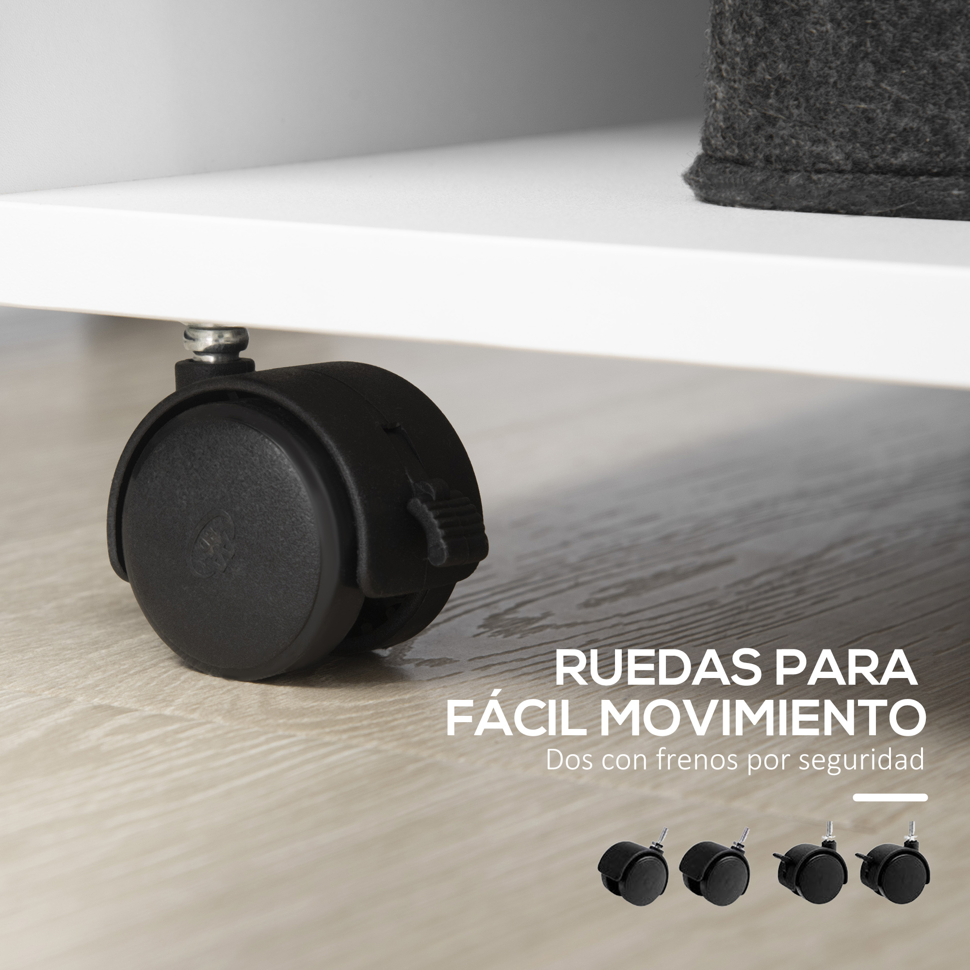 Rueda negra con vástago plateado sobre suelo de madera, tres ruedas más al lado.
