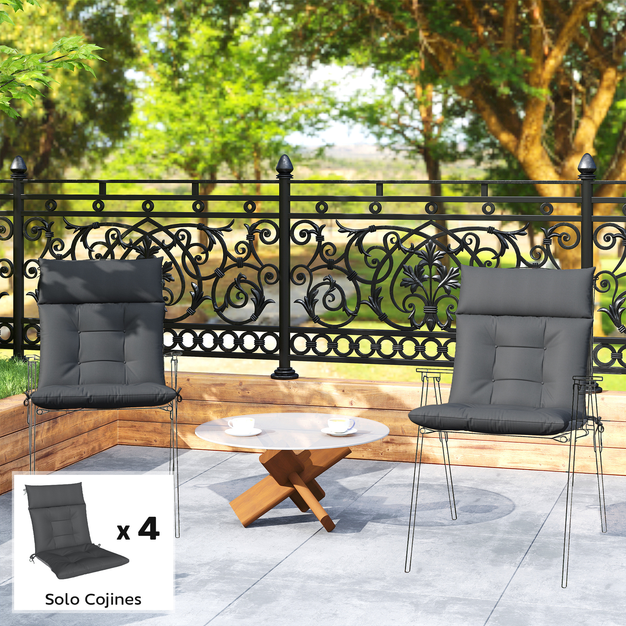 Dos sillas con cojines grises y una mesa blanca con tazas en un patio.