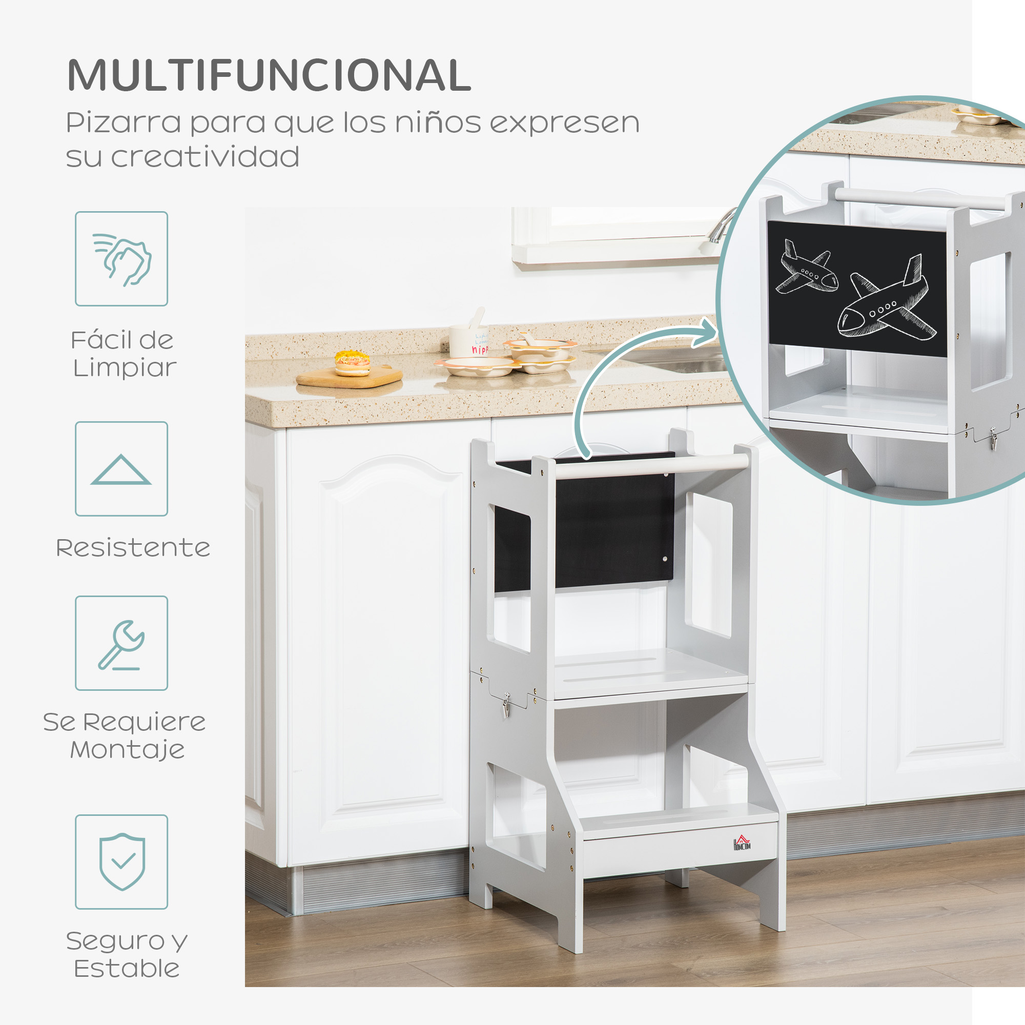 Torre de aprendizaje blanca con pizarra de aviones, ubicada en una cocina.