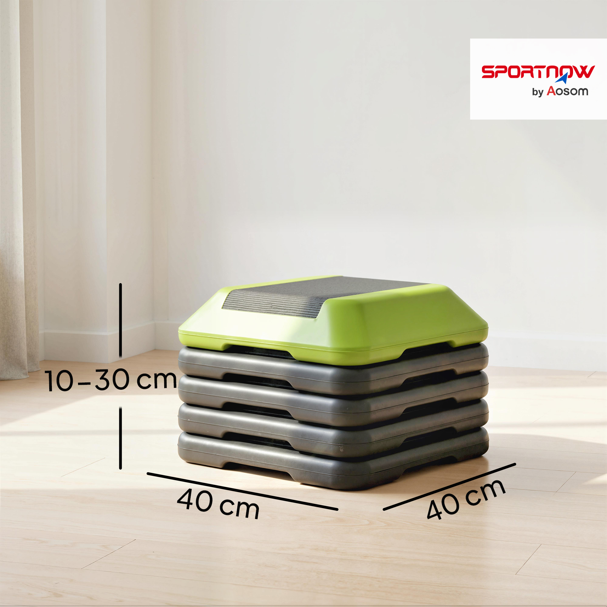 Una tabla de step aeróbico apilada con parte superior verde y bases grises.