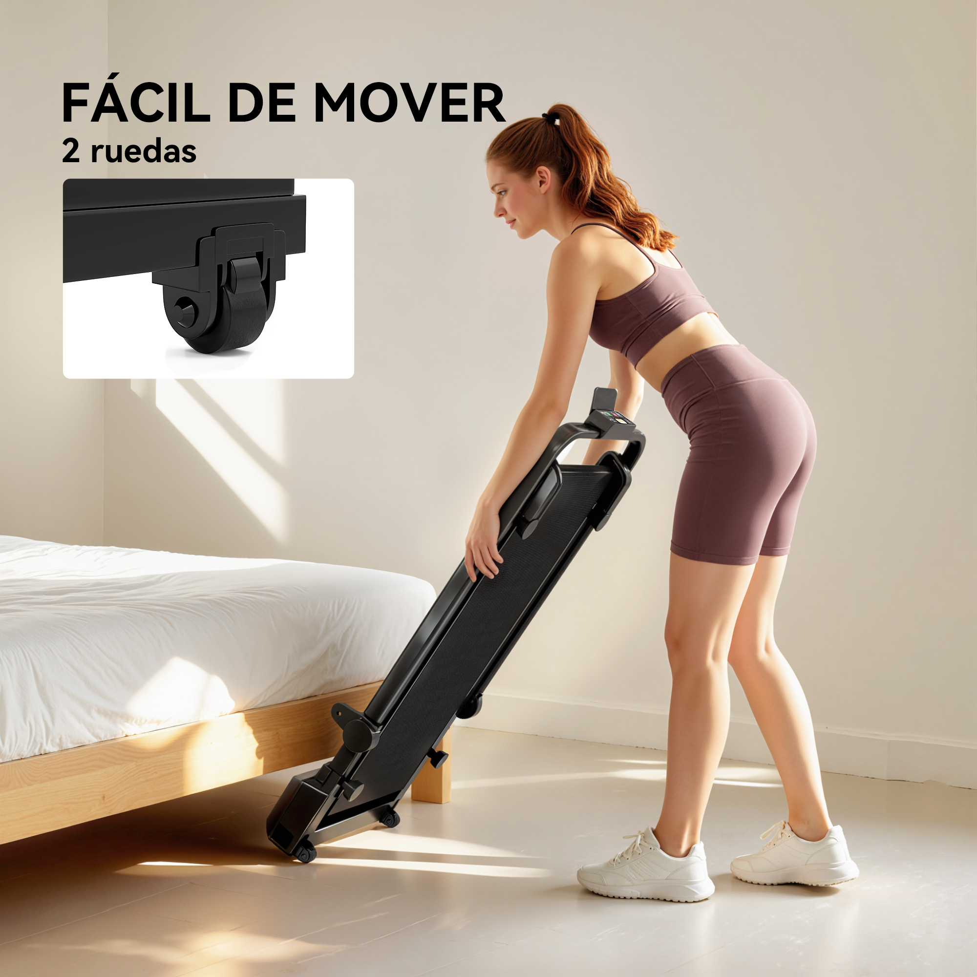 Una mujer pelirroja monta una cinta de correr negra junto a una cama.