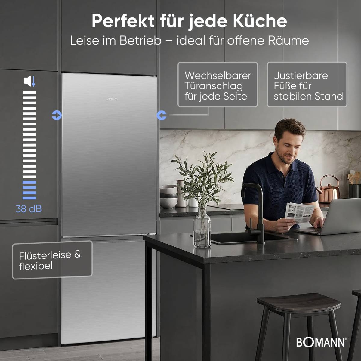 Ein Mann arbeitet am Laptop in einer modernen Küche mit einem leisen Kühlschrank.