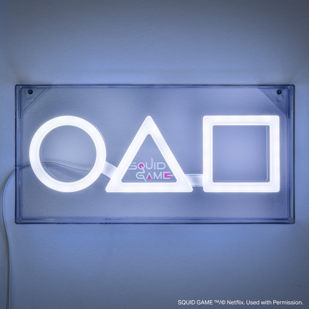 Neonowy znak z symbolami koła, trójkąta i kwadratu. Napis 'SQUID GAME'.