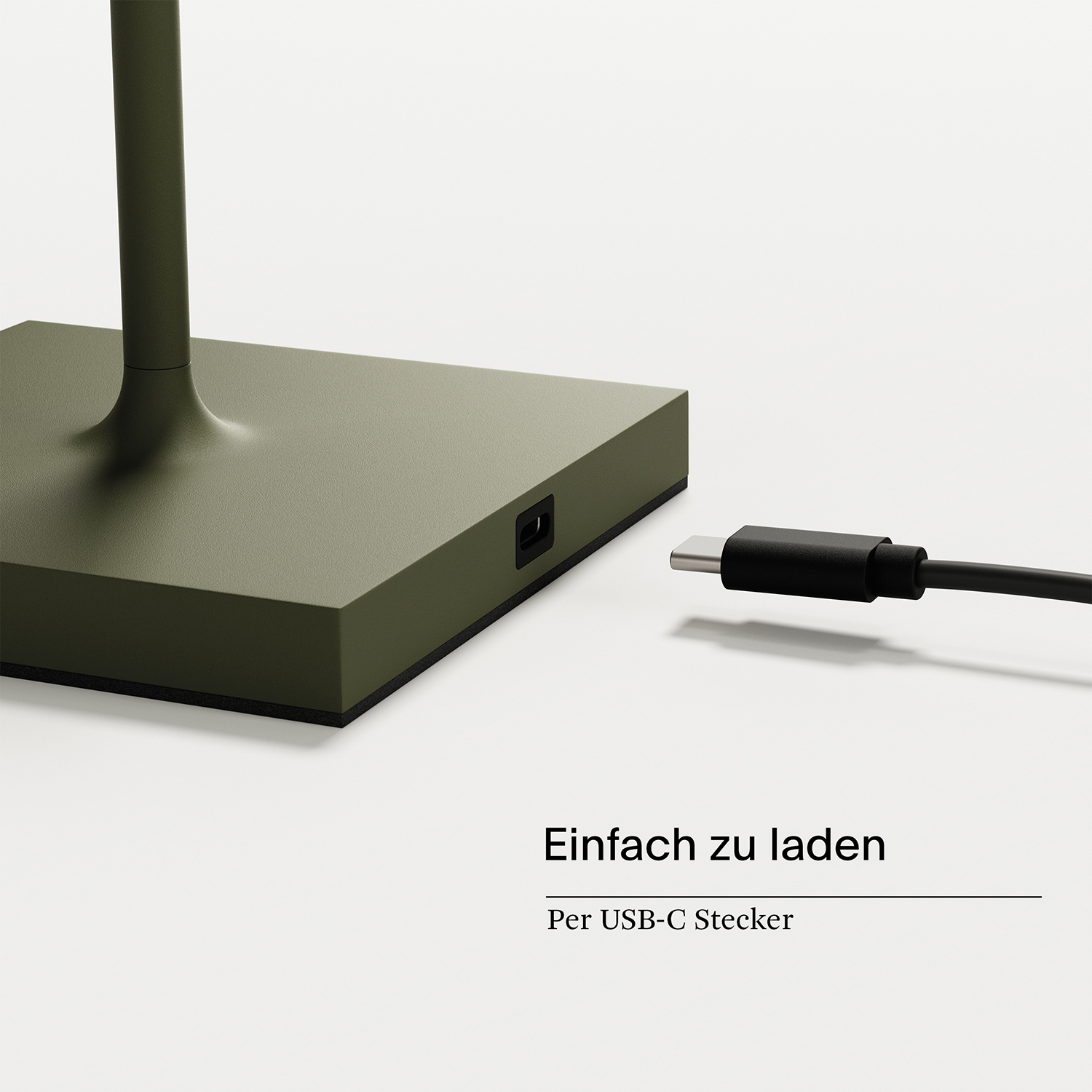 Grüne Lampe mit USB-C-Anschluss und Stecker.